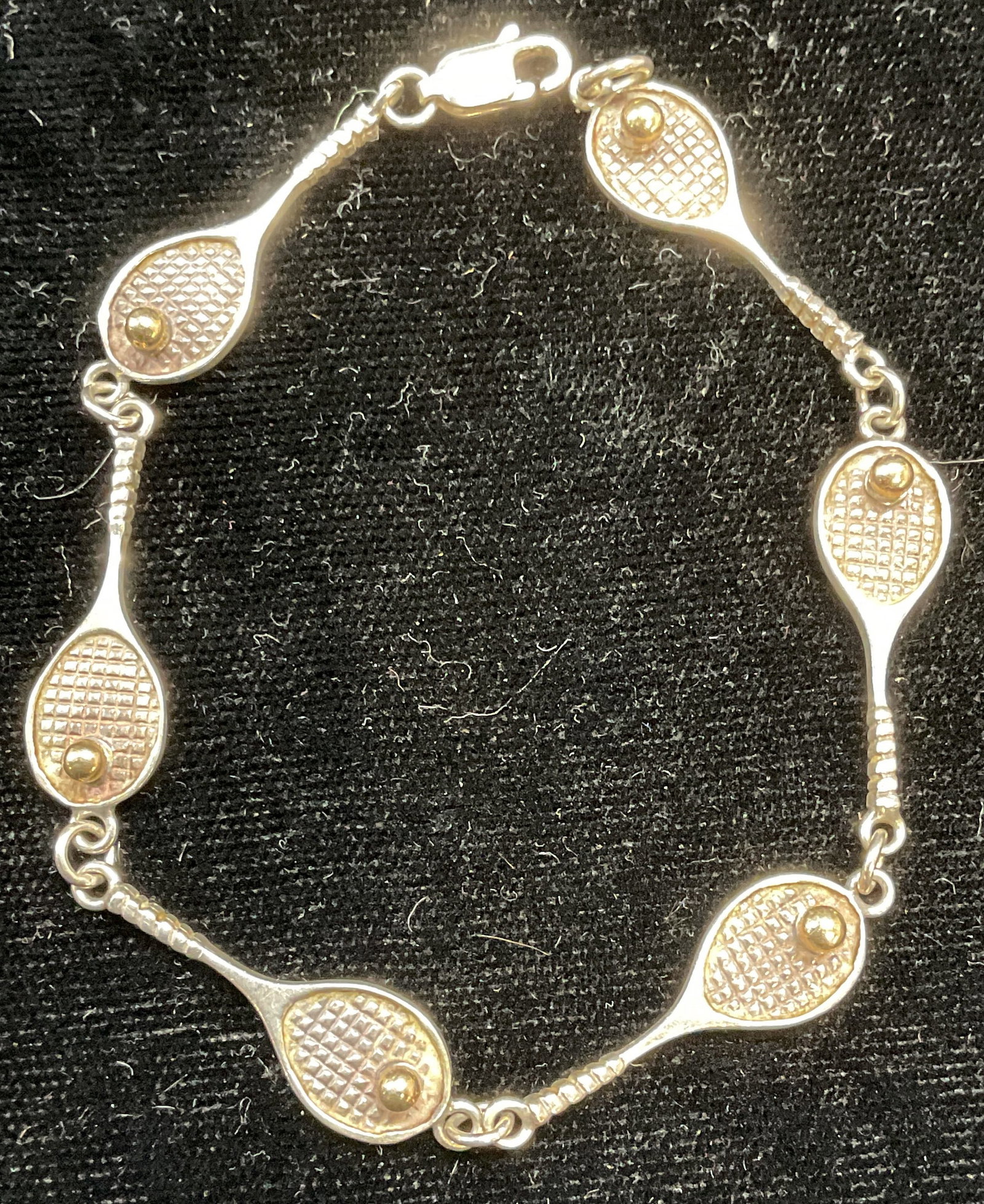 Vintage Sterling Silver Tennis Racket Bracelet: Vintage sterling silver tennis racket motif bracelet. Marked sterling. Measures approx 7 inches long. Total weight 7.5 grams. Some scratching. Jewelry, estate jewelry, fine jewelry, cocktail jewelry, 