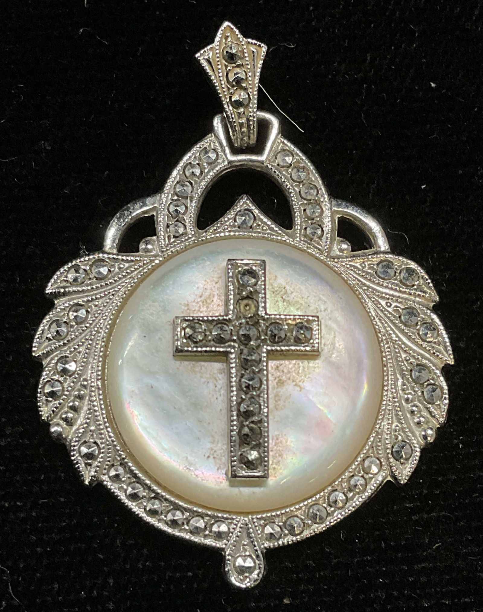 Sterling Silver MOP Marcasite Cross Pendant: Sterling silver, mother of pearl, and marcasite cross motif pendant. Marked sterling. Measures approx 1.25 x 1 inches. Total weight 7.6 grams. Some scratching. Jewelry, estate jewelry, fine jewelry, c