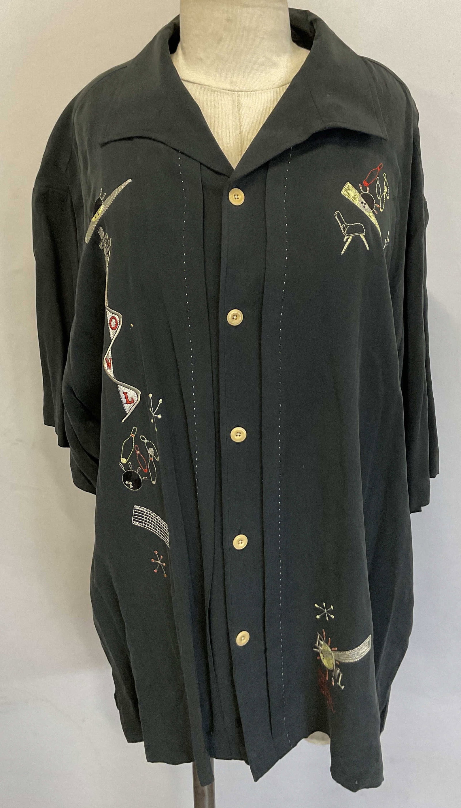 Nat Nast Black Silk Embroidered Button Down: Nat Nast black silk embroidered short sleeve button down. Embroidered bowling icons all over garment. Size L. Silk material. Pulling on sleeve stitching. Property of 1980s known Rockers Manhattan esta