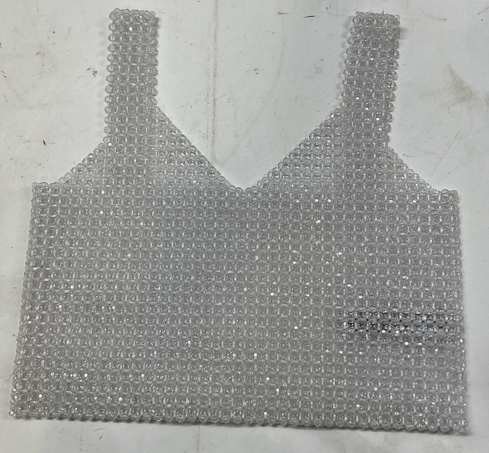 Clear Beaded Sleeveless Crop Top: Clear faceted beaded sleeveless crop top. Measures approx 17 inches across chest. Beads make a floral pattern. Property of 1980s known Rockers Manhattan estate. Beaded top womens fashion 4H