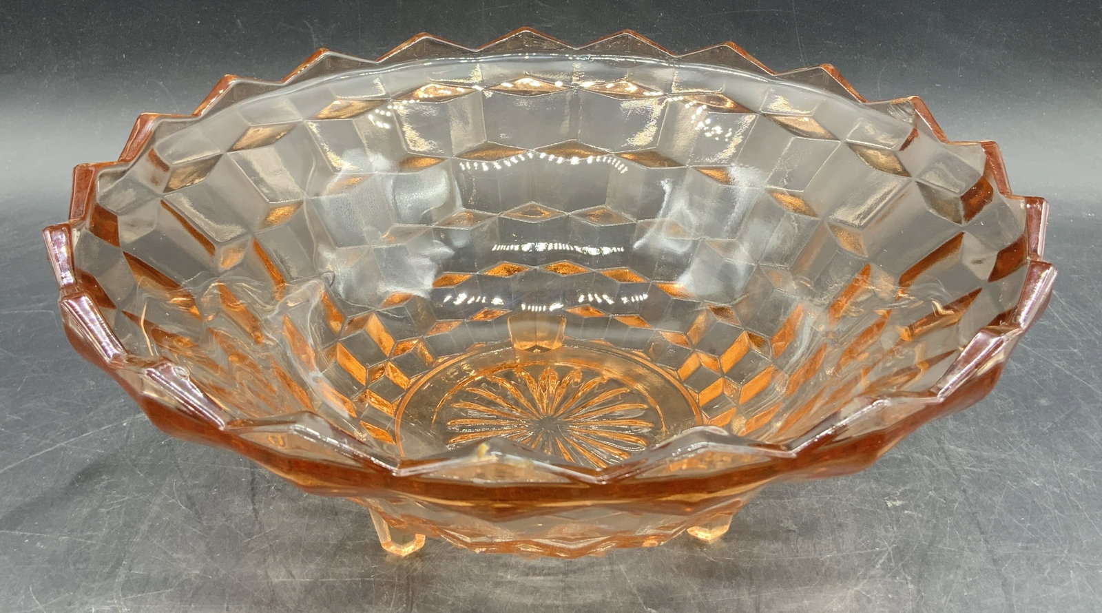 Vntg Pink Depression Glass Cubist Footed Bowl: Bowl features a geometric, faceted cube design, a sawtooth rim & 3 small feet. Bowl is pink depression glass. No visible signature or markings. Surface wear consistent to age, use & exposure. Measurem