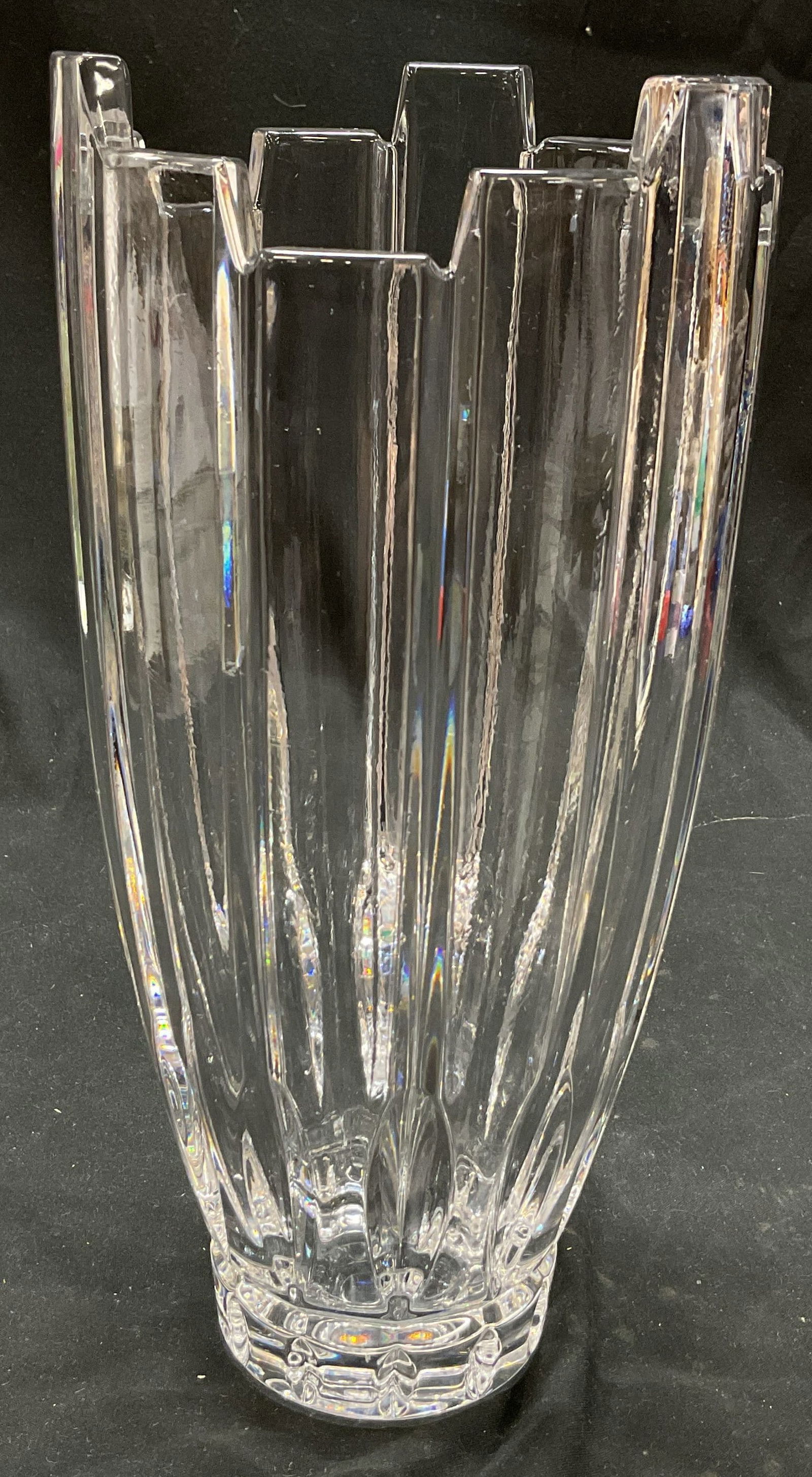 Scalloped Crystal Vase: Scalloped crystal vase. Vertical ribbing and faceted around body. Top rim is scalloped and pointed. Thick walled. Rounded base. Measures ht approx 10 inches diam approx 4 1/2 inches. Some wear consist