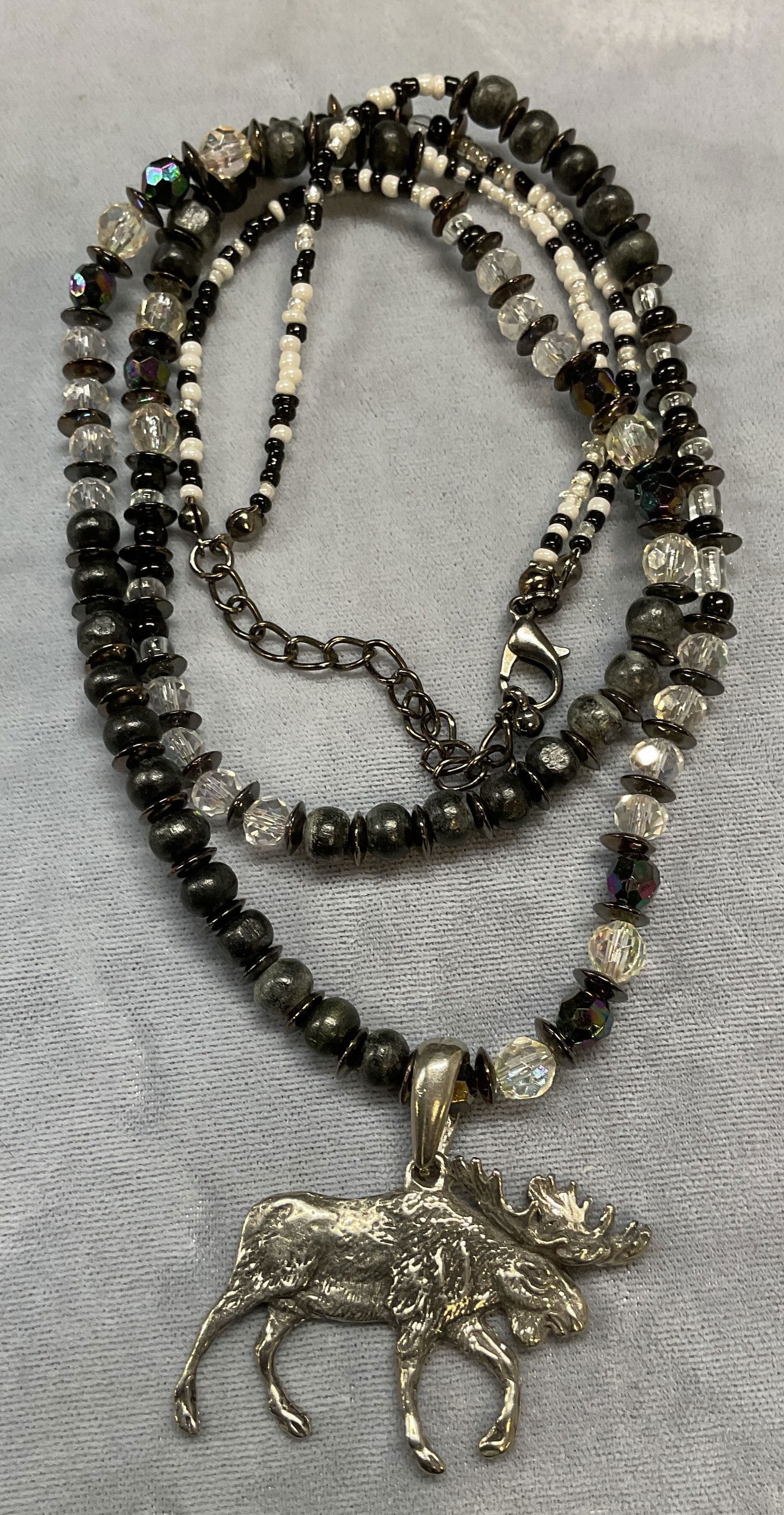 Black & White Beaded Moose Pendant Necklace: Black and white lucite crystal beaded double strand necklace with silver tone moose pendant. Drop length approx 8.5 inches. Some scratching. Jewelry, estate jewelry, costume jewelry, cocktail jewelry,