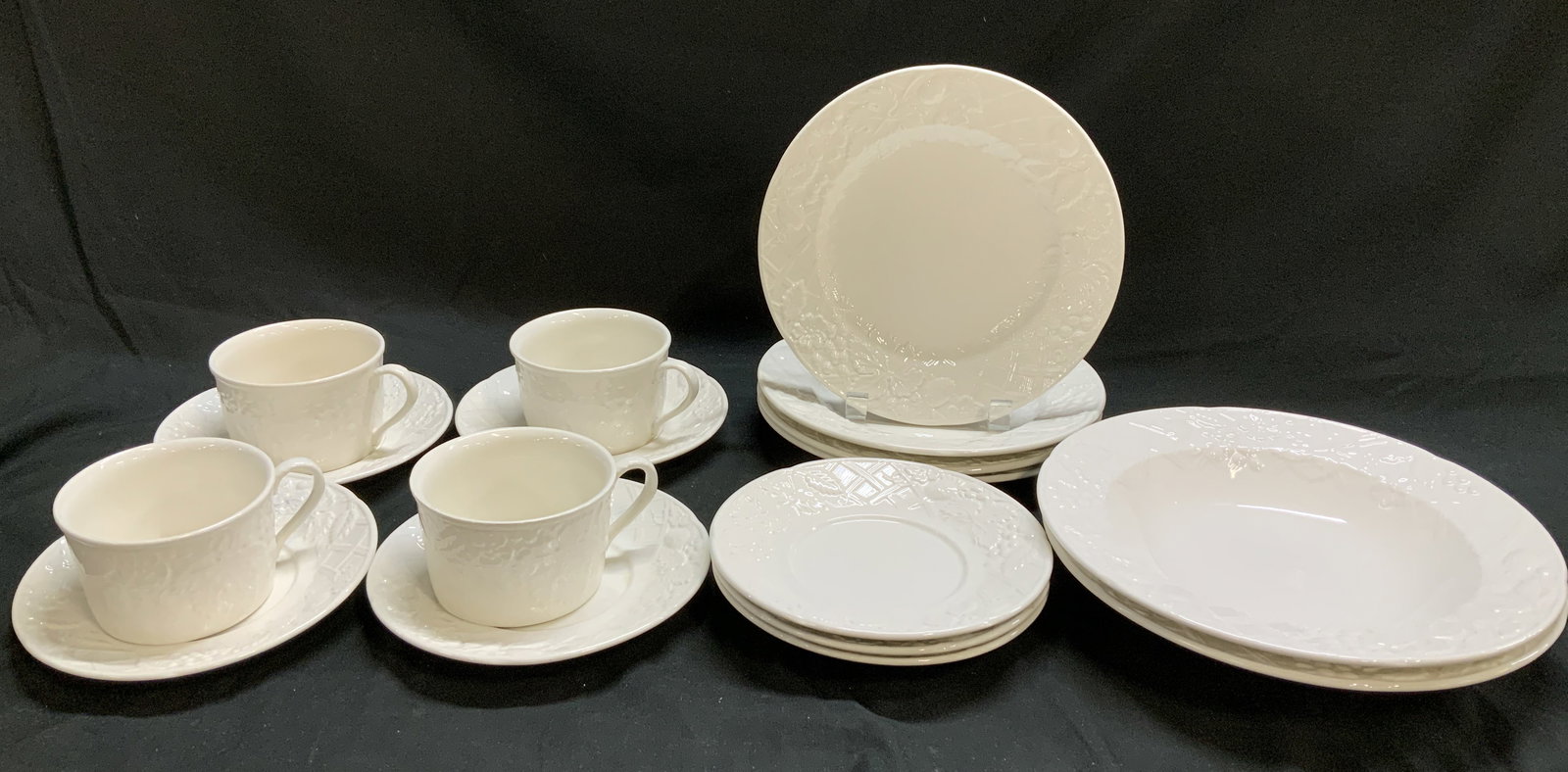 Set 17 MIKASA English Countryside Tableware: Lot includes, 4 teacups, 7 saucers, 4 salad plates & 2 bowls. Pieces are white & feature an embossed floral pattern. Glossy finish. Signed & marked on underside. Reads, MIKASA. ENGLISH COUNTRYSIDE. WH