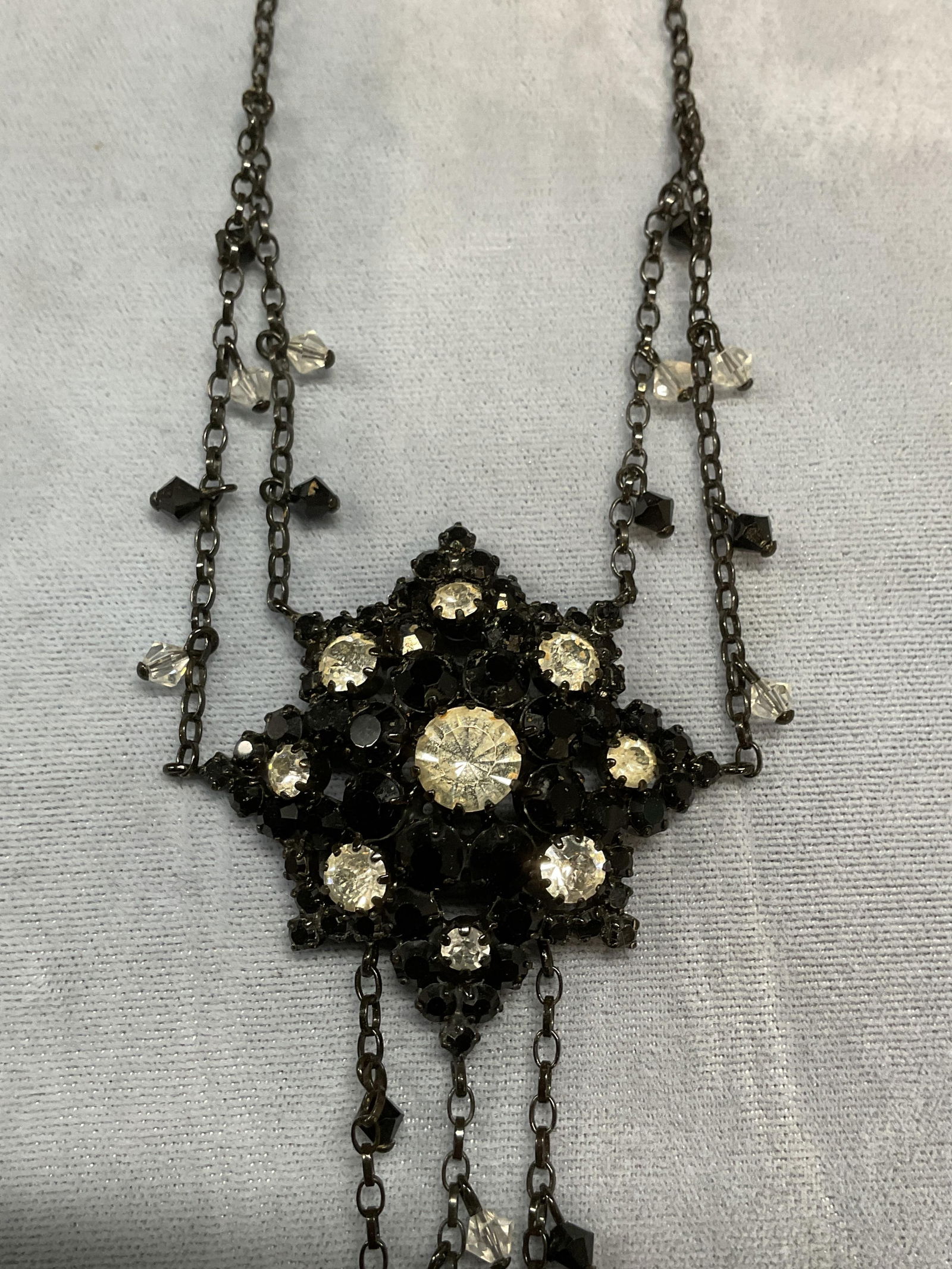 Vintage Black Crystal Pendant Necklace: Vintage black pendant necklace with colorless and black crystal decoration. Drop length approx 8 inches. Pendant approx 5.75 inches long. Includes box. Some scratching. Jewelry, estate jewelry, costum