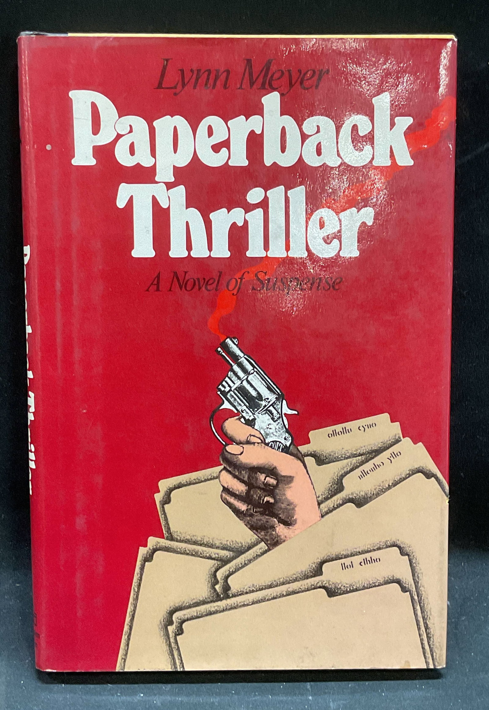 Lynn Meyer Paperback Thriller 1st Ed 1975: Hardcover first edition copy of Paperback Thriller by Lynn Meyer. Published by Random House, 1975. Measures approx 8.5 x 5.5 inches. Wear to cover, pages, and binding consistent with exposure. Books, 