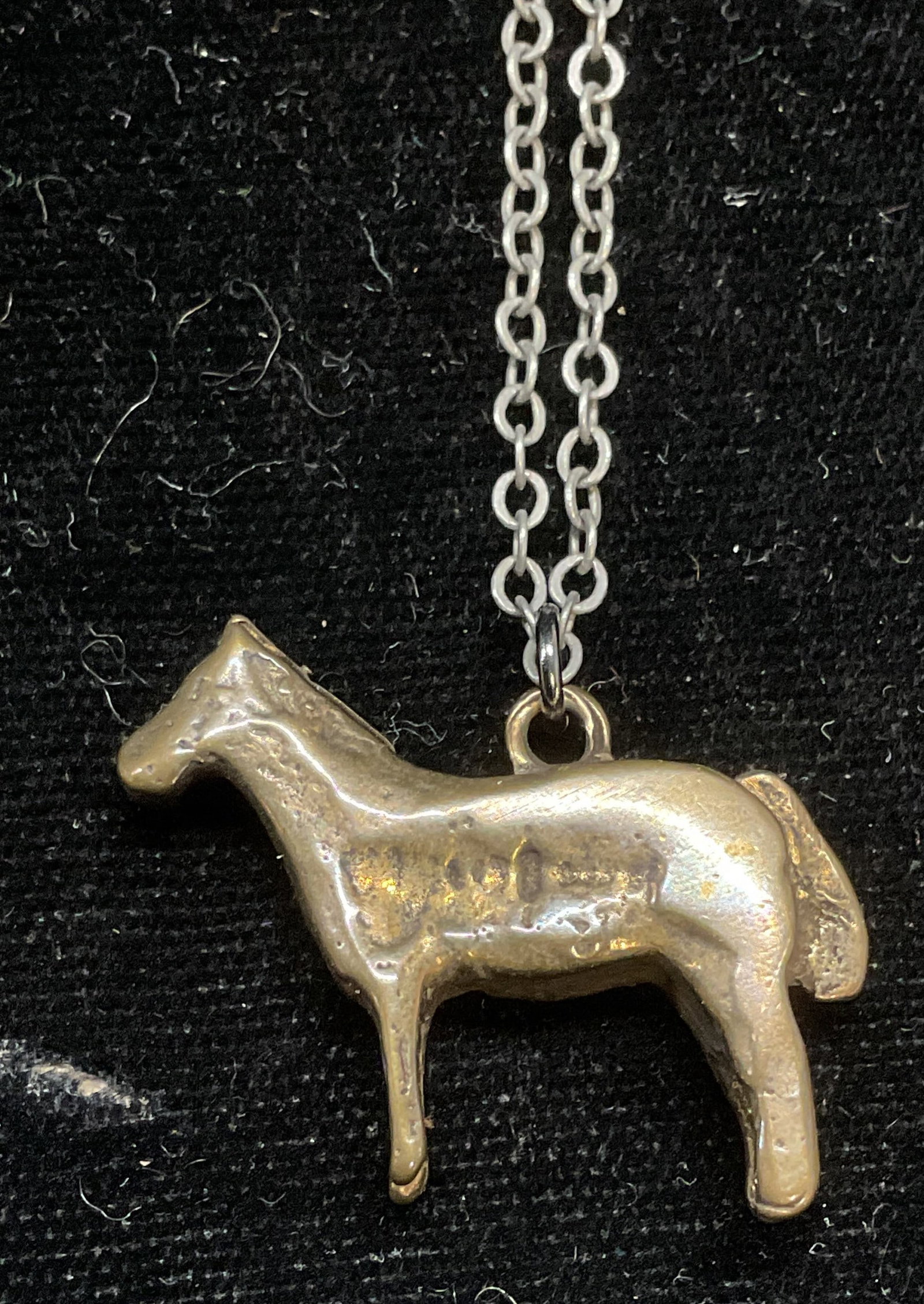Gold Tone Horse Pendant Necklace: Gold tone horse motif pendant with silver tone chain necklace. Drop length approx 12 inches. Pendant approx 1 x 1 inches. Some scratching. Jewelry, estate jewelry, costume jewelry, cocktail jewelry, f