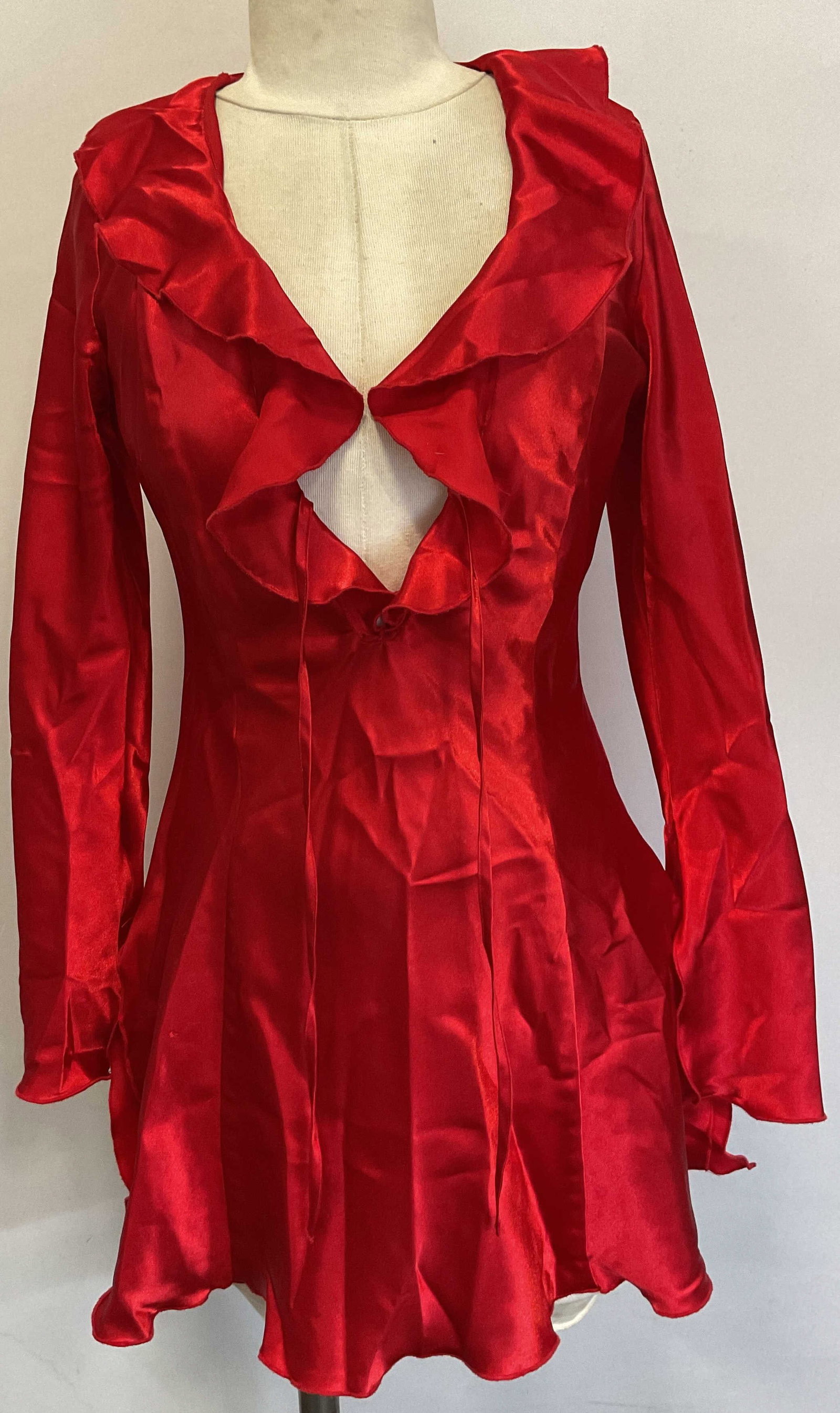 Fredericks Of Hollywood Ruffled Lingerie Dress: Fredericks Of Hollywood red ruffled long sleeve lingerie dress. Size S. Polyester material. Ruffled trim along collar and sleeves. Split seam design. Includes two strings to tie. Property of 1980s kno