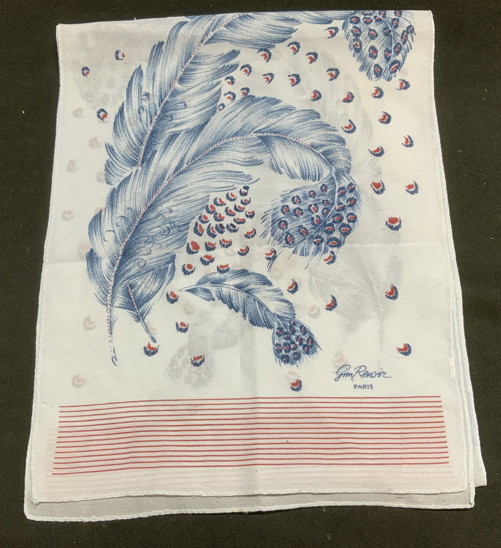 Gin Renoir Blue & Red Feather Motif Scarf FRANCE: Scarf features a blue & red feather print. Piece appears to be synthetic material. Marked on bottom. Reads, Gin Renoir Paris. Surface wear consistent to age, use & exposure. Measurements: length 53.5i