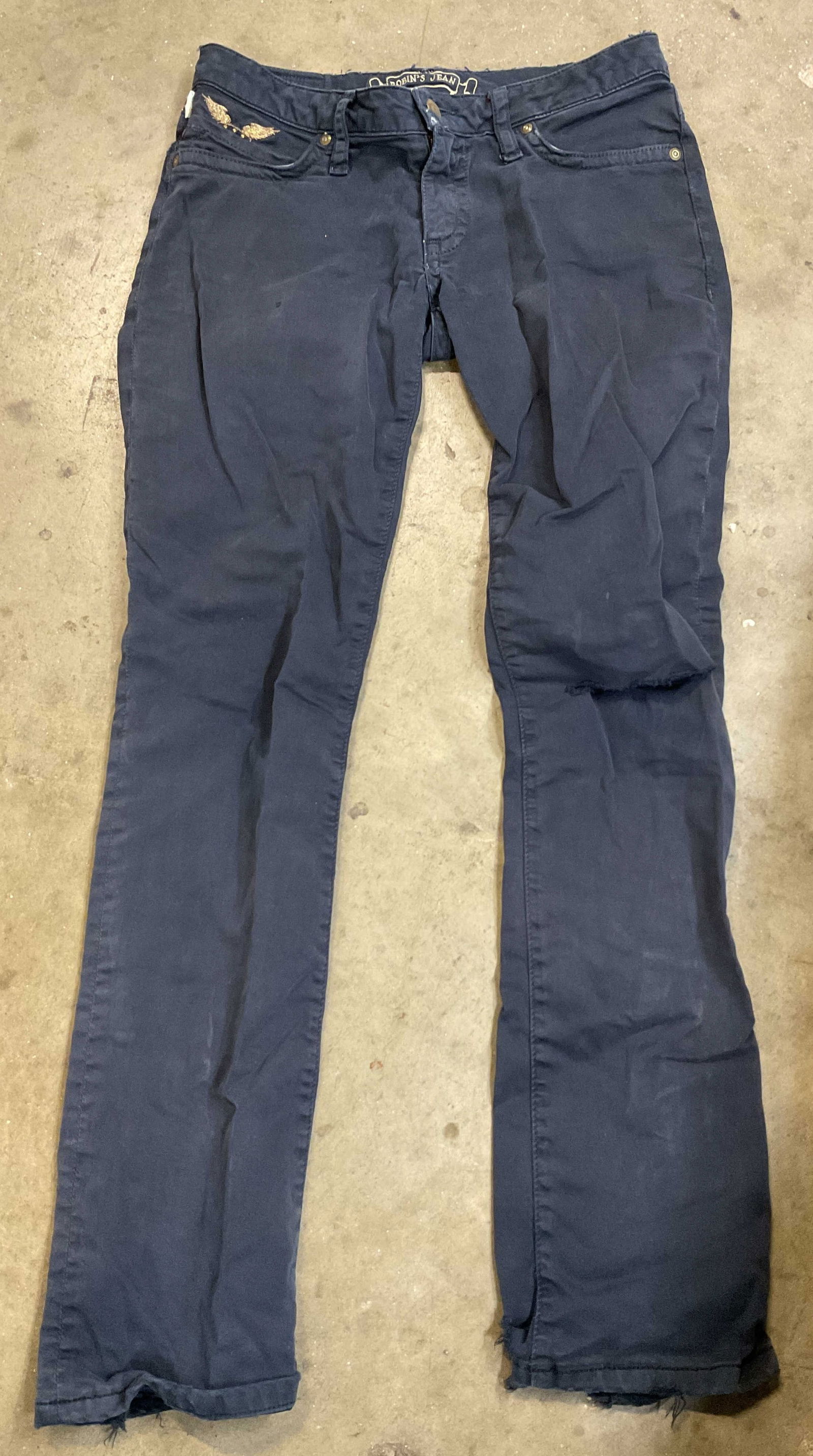 Robins Jean Blue Embroidered Pants USA: Robins Jean navy blue embroidered and studded pants. Size 28. Made in USA. Cotton material. Frontside features metallic gold toned embroidered wing design with gold toned studs. Backside features meta