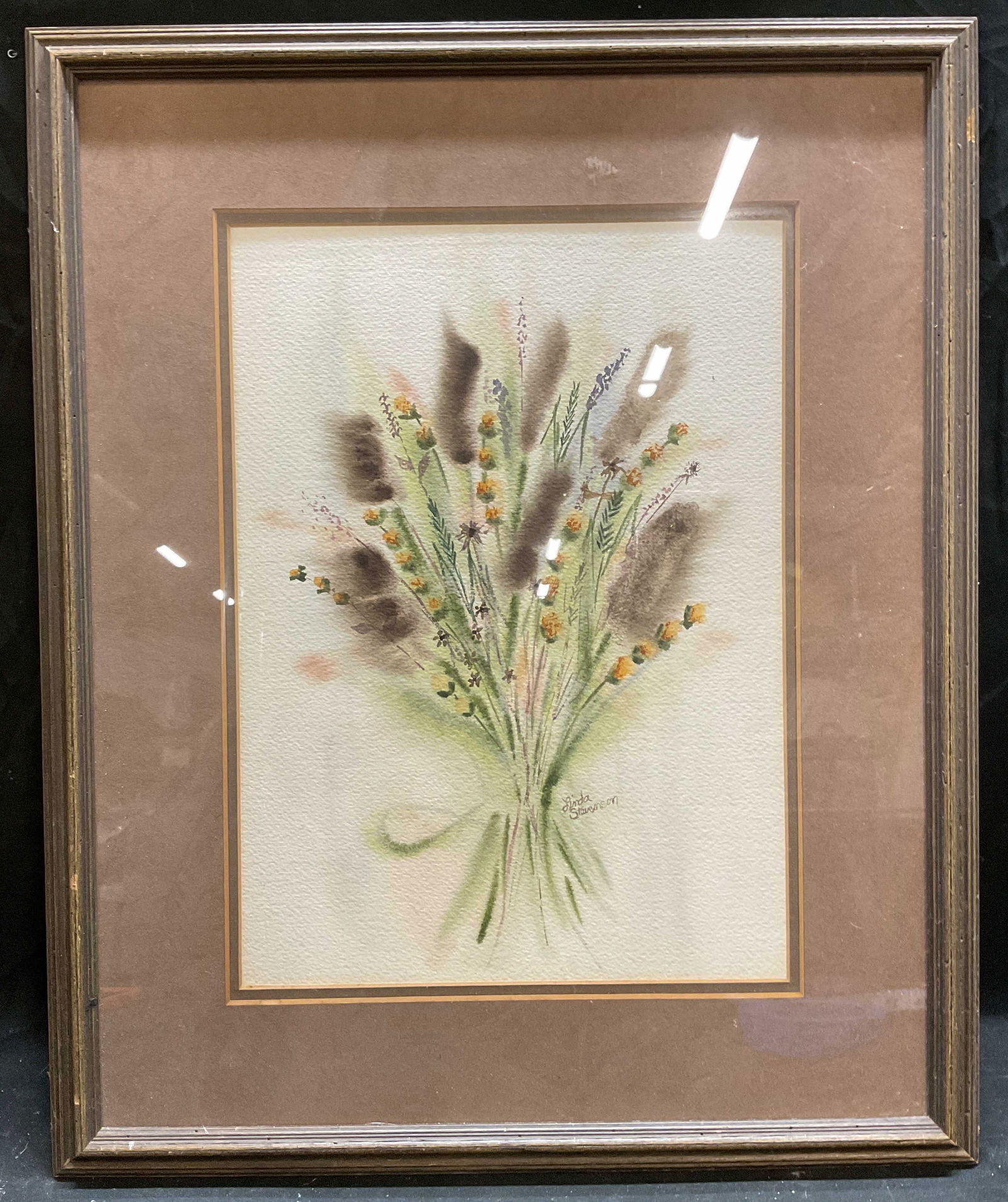 Sgn Linda Stevenson Botanical Watercolor Painting: Framed and matted watercolor painting on paper. Signed lower right, Linda Stevenson. Botanical painting with cattails and yellow flowers. Wood frame. Not examined out of frame. Frame measures approx 2
