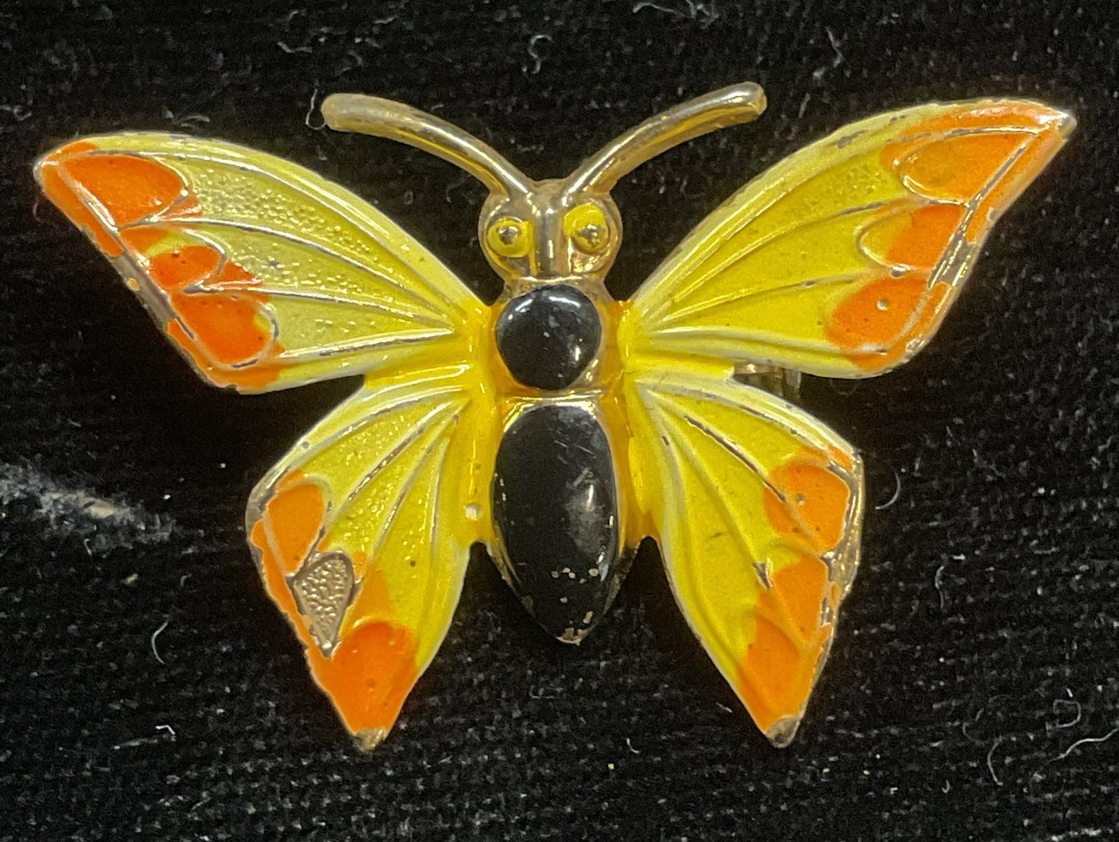 Vintage Yellow Enamel Butterfly Brooch: Vintage gold tone butterfly brooch with yellow, orange and black enamel. Measures approx 1 x 1.5 inches. Some scratching. Jewelry, estate jewelry, costume jewelry, cocktail jewelry, fashion jewelry, a