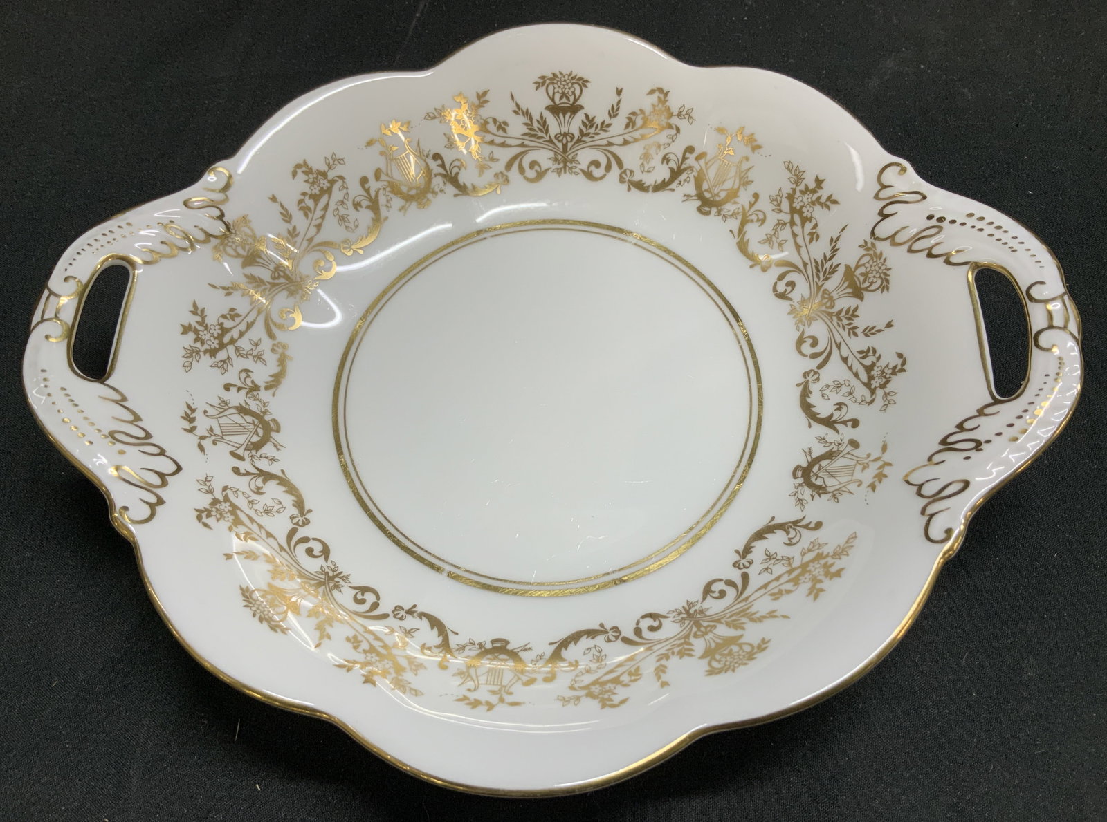 Coalport Allegro Bone China Handled Dish ENGLAND: Small serving dish w handles. Dish features an Allegro pattern of gold floral designs w musical instruments. Scalloped edge. Signed & marked on underside. Reads, BONE CHINA. COALPORT. MADE IN ENGLAND.