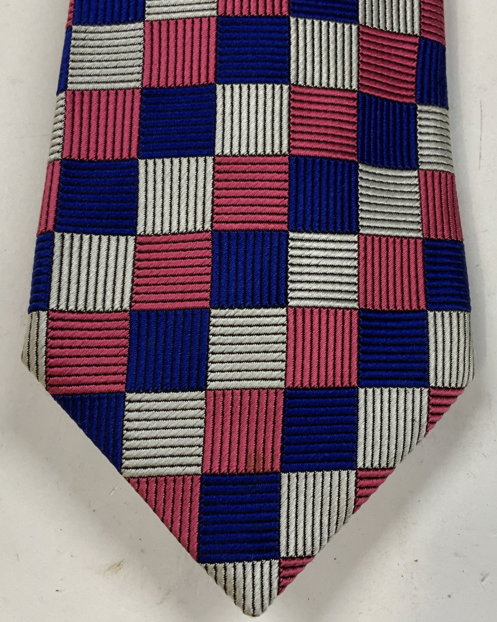 Turnbull & Asser Checkered Silk Necktie ENGLAND: Necktie is 100% silk & is hand-made. Features a pink, blue & white checkered pattern. Signed & marked. Reads, HAND MADE. 100% SILK. TURNBULL & ASSER. Surface wear consistent to age, use & exposure. Me