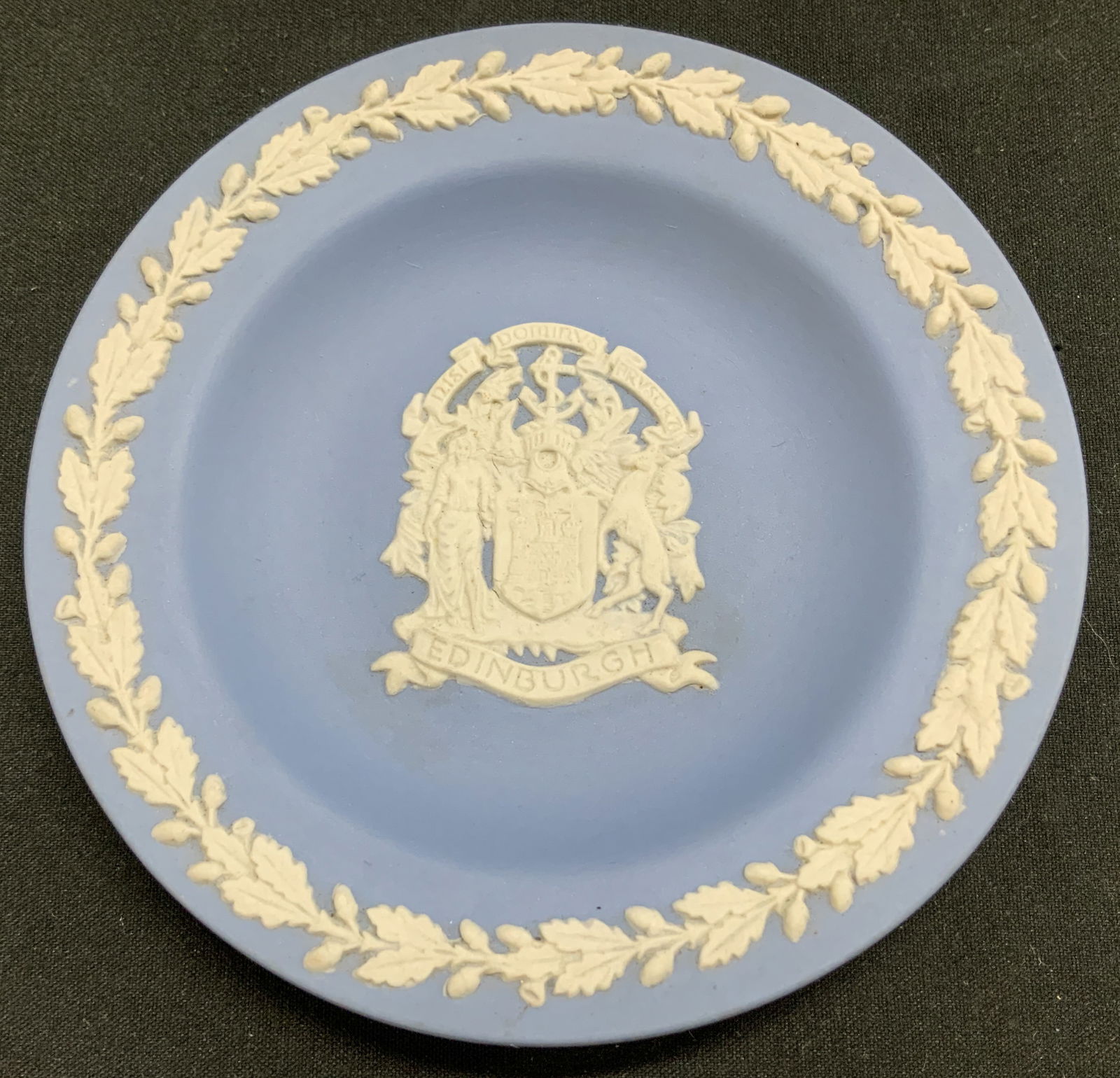 Wedgwood Blue Jasperware Trinket Dish ENGLAND: Trinket dish features white relief neoclassical fig & animal. Surrounded by a raised foliage border. Center of dish reads, RISI DOMIRVS ARVSCRT. EDINBURGH. Light blue toned. Signed & marked on undersi
