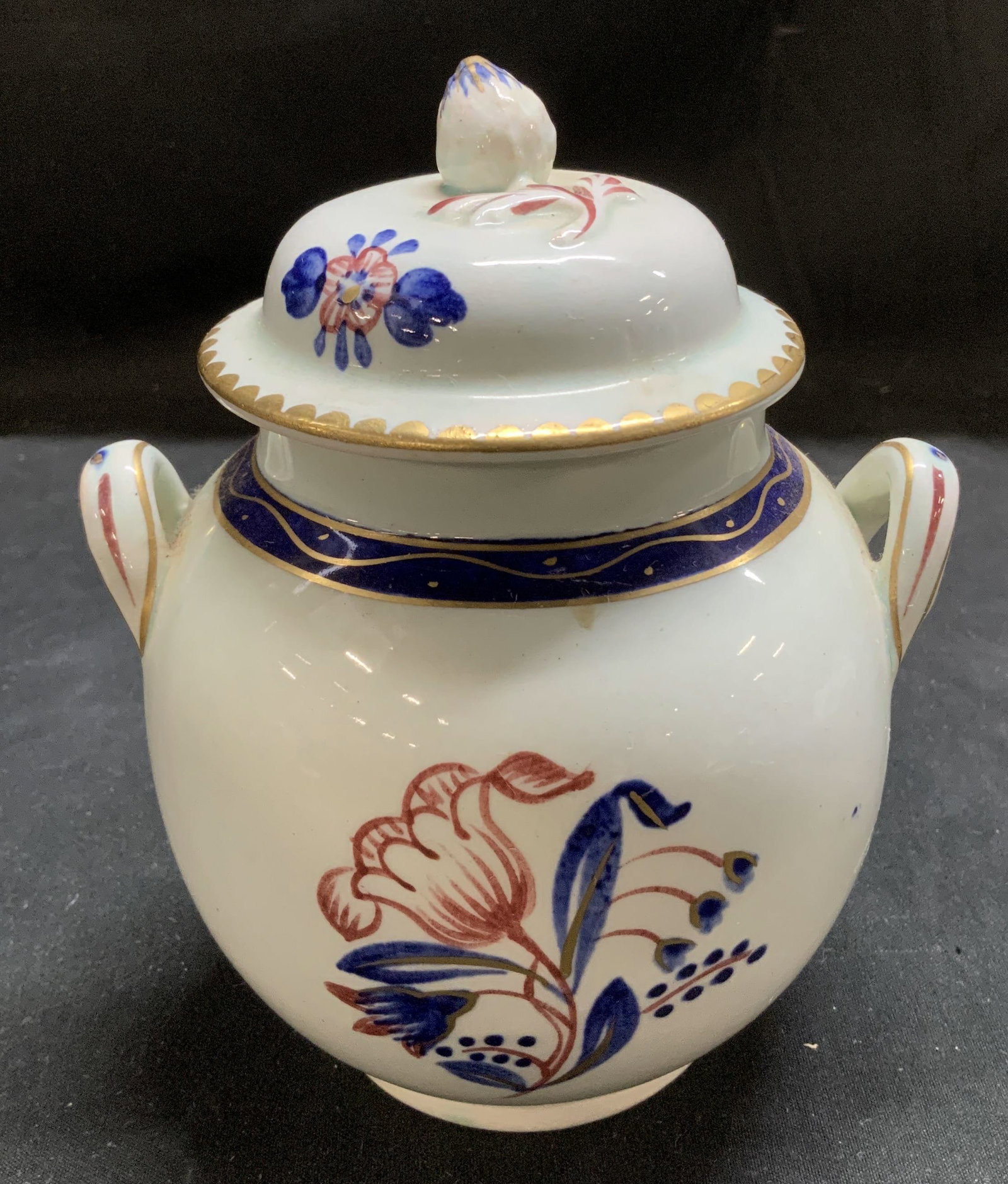 Adams Calyx Ware Tulip Lidded Sugar Bwl ENGLAND: Sugar bowl features hand-painted tulip patterns. Cobalt blue, red & gilt accents. 2 small handles & a decorative finial on lid. Signed & marked on underside. Reads, ESTBD 1657. ADAMS ENGLAND. CALYX WA