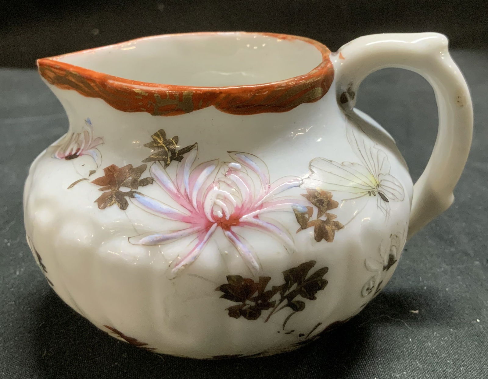 Vntg Sgnd Chinese Hand Painted Floral Porc Creamer: Creamer is porcelain & features hand-painted floral motifs. Gilt accents & dark red trim. Ornate handle. Signed & marked on underside. Visible Chinese characters. Surface wear consistent to age, use &