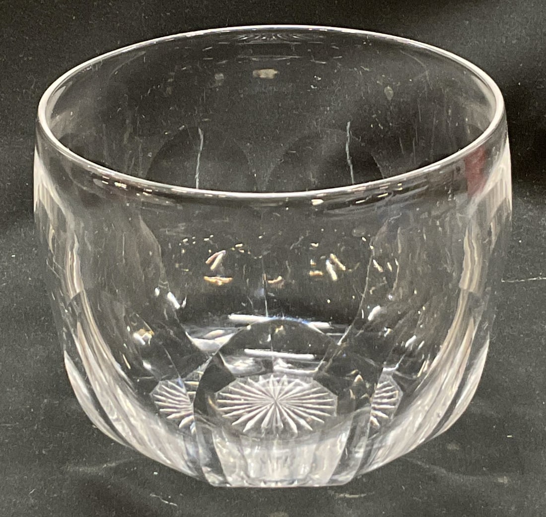 Vintage Crystal Bowl: Vintage crystal bowl. Faceted and scalloped design. Starburst design on underside. Small round shape. Measures ht approx 4 inches diam approx 5 inches. Some scratching observed and surface wear consis