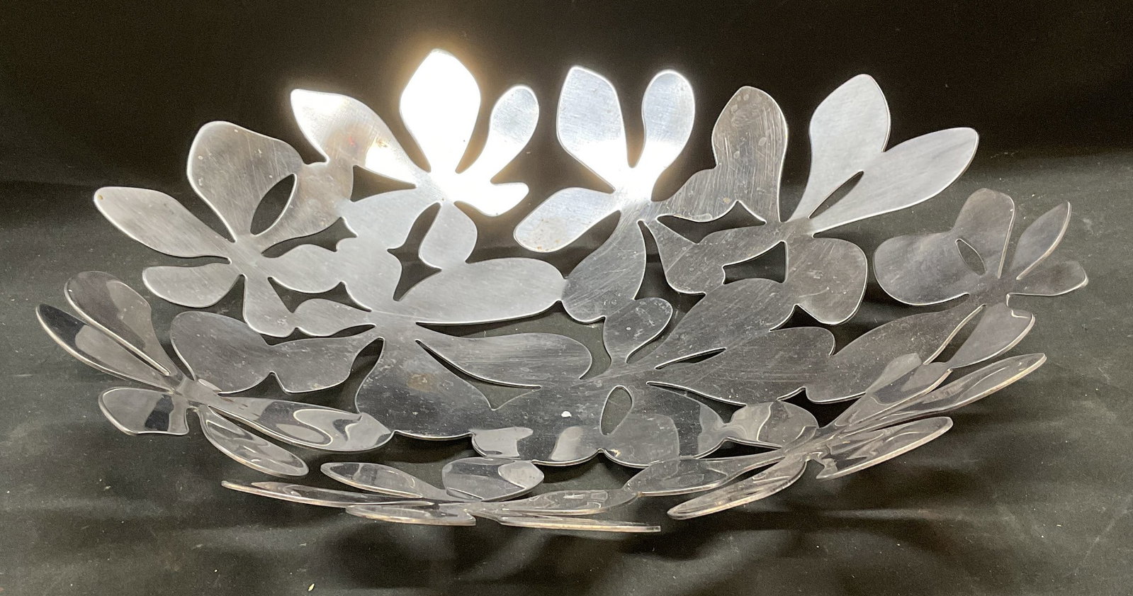 IKEA Floral Leaf Stainless Steel Bowl: IKEA stainless steel bowl designed by Monika Mulder. Floral leaf reticulated pattern. Unsigned. Measures approx 16 x 3.75 inches. Some scratching. IKEA bowl, stainless steel bowl, leaf bowl, floral bo