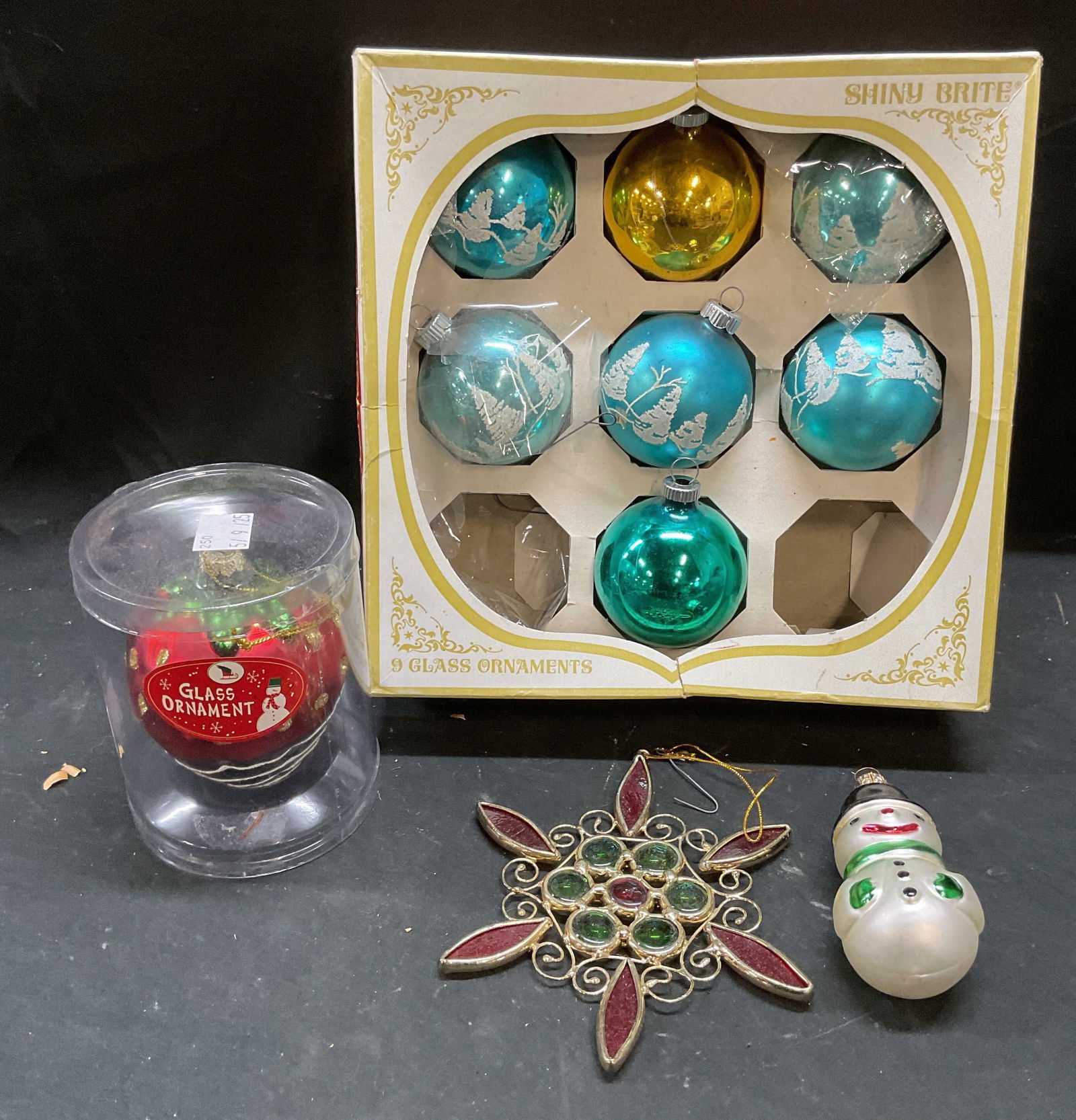Lot 10 Vtg Shiny Brite+ Glass Christmas Ornaments: Lot of 10 Vintage glass Christmas tree ornaments. 7 Shiny Brite ball ornaments in blue and gold, made in USA. 1 chocolate strawberry motif ornament. 1 red and green snowflake ornament. 1 snowman ornam
