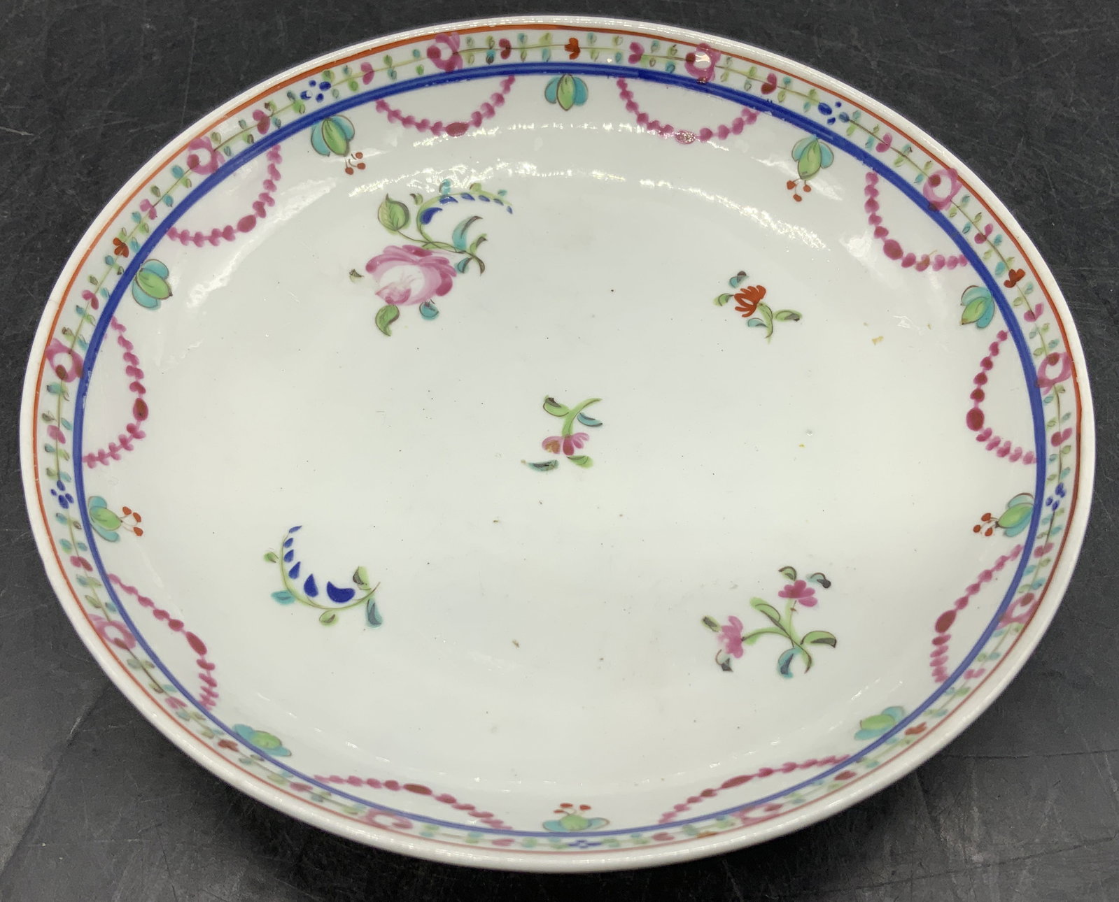 Vntg Floral Motif Porcelain Small Bowl: Small bowl is porcelain material & features hand-decorated floral motifs. Green, pink, blue & purple tones. Surface wear consistent to age, use & exposure. Measurements: length 5.2in x width 5.2in x h