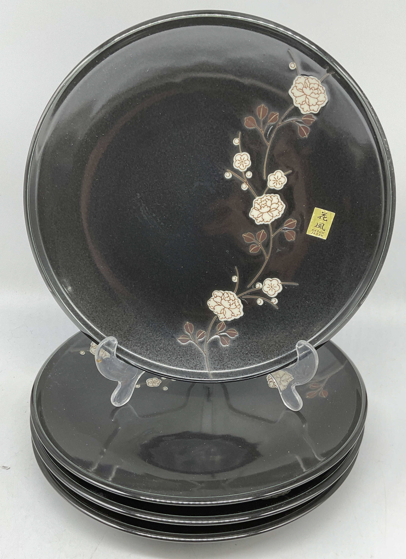 4 Kafuh Black Floral Porcelain Plates, Japan NWT: Set of 4 Kafuh porcelain plates, black glaze with hand painted floral designs. Signed on labels. New with tag. Made in Japan. Measure approx 10 inches wide. Some wear consistent with exposure. Kafuh p