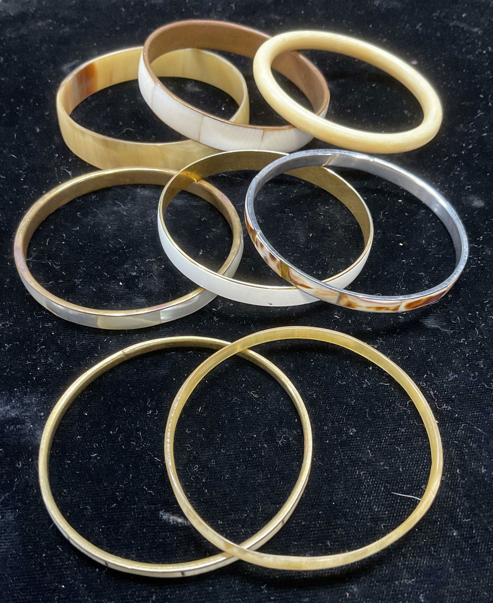 Lot 8 Bone, Horn, Shell Enamel Bangle Bracelets: Lot of 8 bangle bracelets. Bone, horn, shell, and enamel. Largest approx 2.75 inches wide. All pieces have wear including scratching. Jewelry, estate jewelry, costume jewelry, cocktail jewelry, fashio