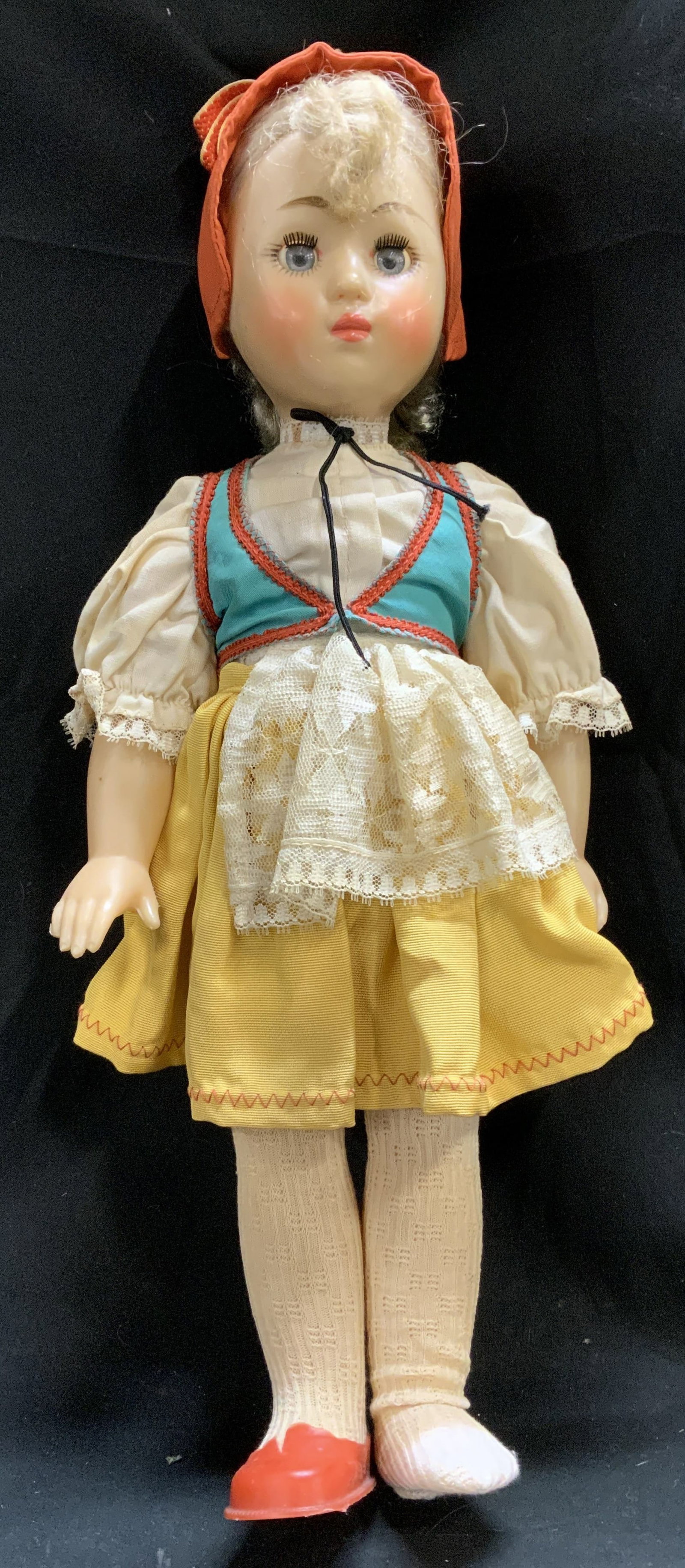 Vntg German Folk Dress Girl Doll 18in: Doll is dressed in traditional German folk-style attire. Doll has hand-painted features. She is wearing teal vest, cream blouse & yellow skirt. Doll is missing a red shoe. Hard plastic material. No vi