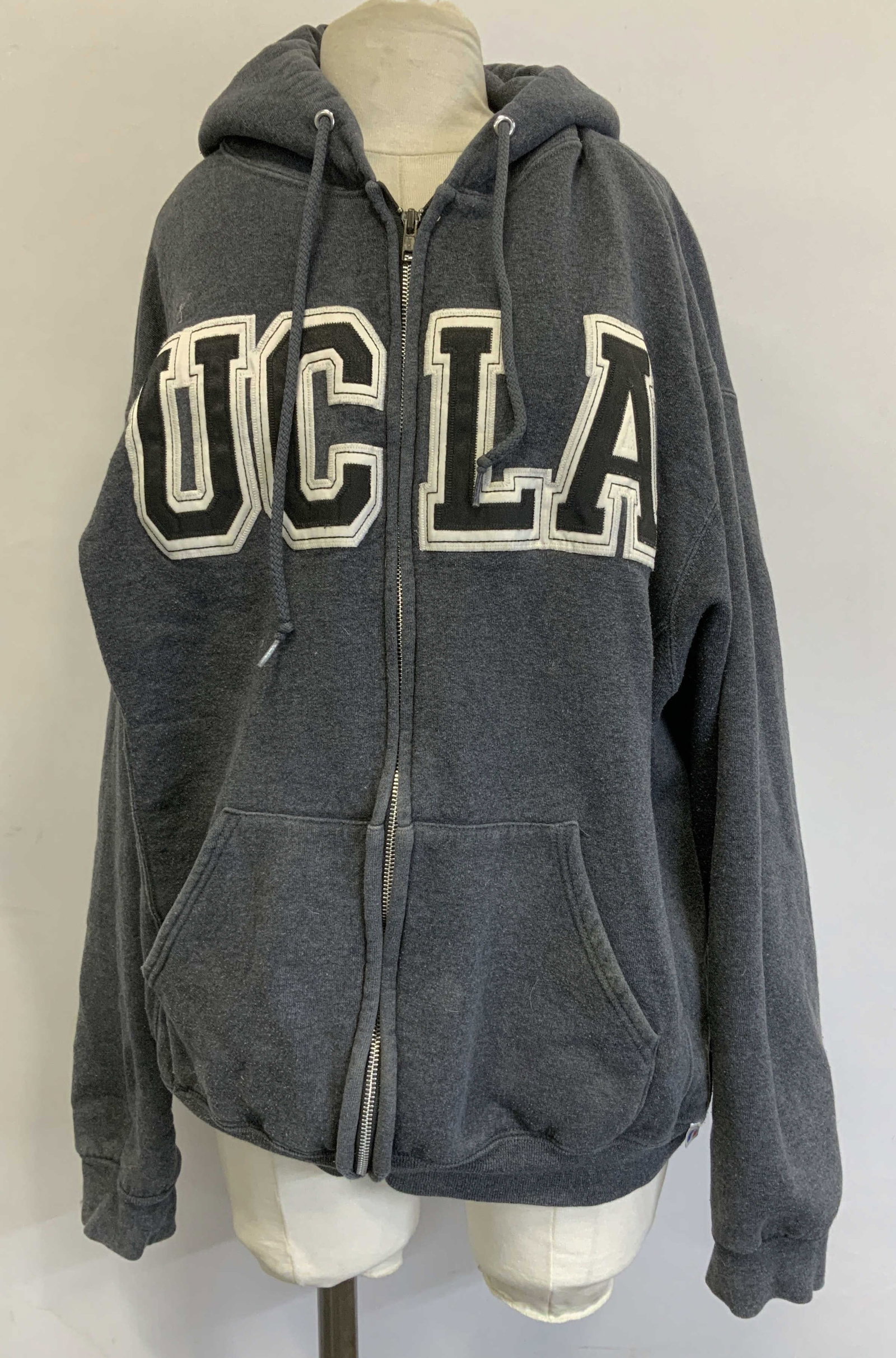 Russell Athletics UCLA Grey Hoodie HONDURAS: Vintage gray UCLA zipper hoodie with embroidered and appliqued block lettering. Size Large. Signed & marked. Reads, RUSSELL ATHLETICS. MADE IN HONDURAS. Surface wear consistent to age, use & exposure.