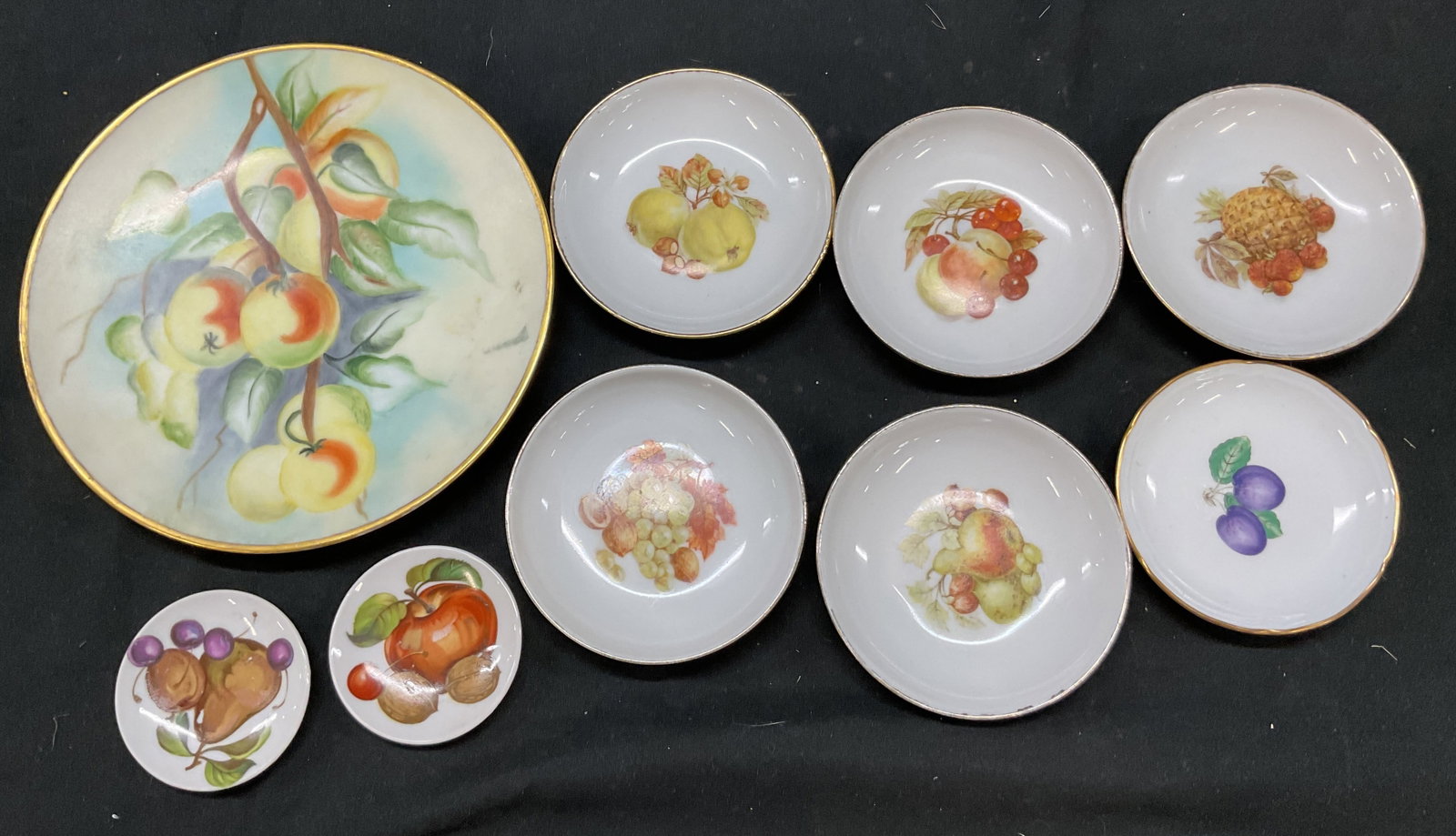 Grp Lot 8 Porcelain Plates & Bowls Italy & Israel+: Group lot of 8 fruit porcelain plates and bowls. Some signed on underside. Some underside labels read as follows R. Fischer Porzellan Z?rich, Made in Israel, Italy, and more. Features fruits including