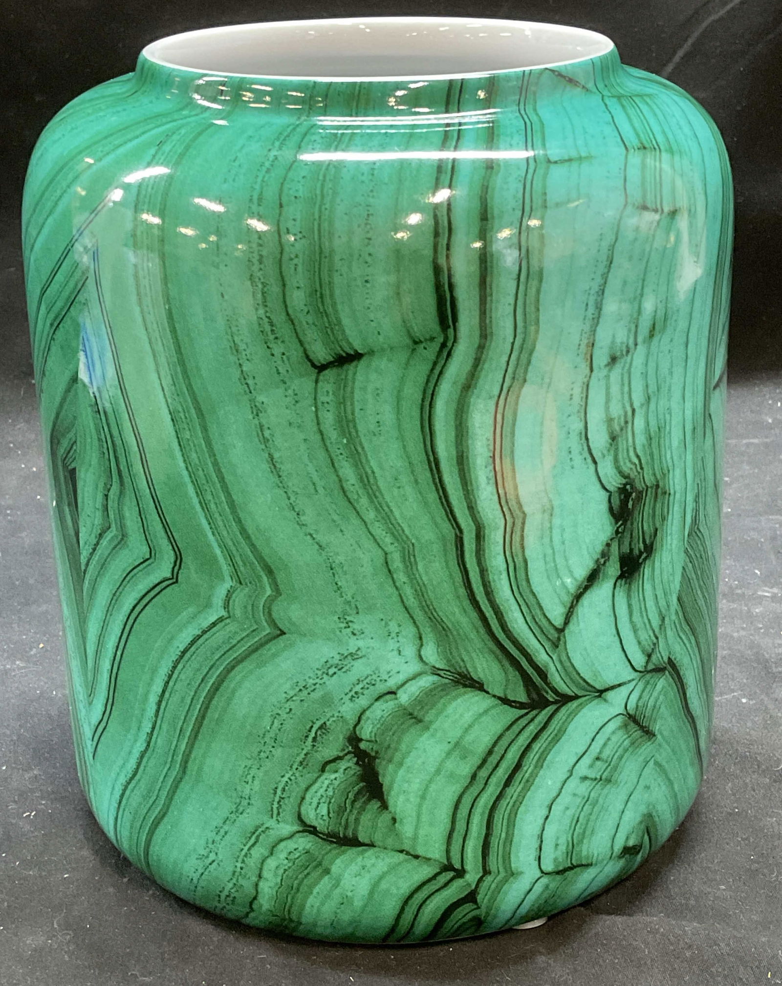 Tozai Faux Malachite Green Ceramic Vase: To ai ceramic vase. Cylindrical shape. Faux malachite green design. Signed. Measures approx 6 x 7.25 inches. Some wear consistent with exposure. Tozai vase, faux malachite vase, green vase, ceramic va