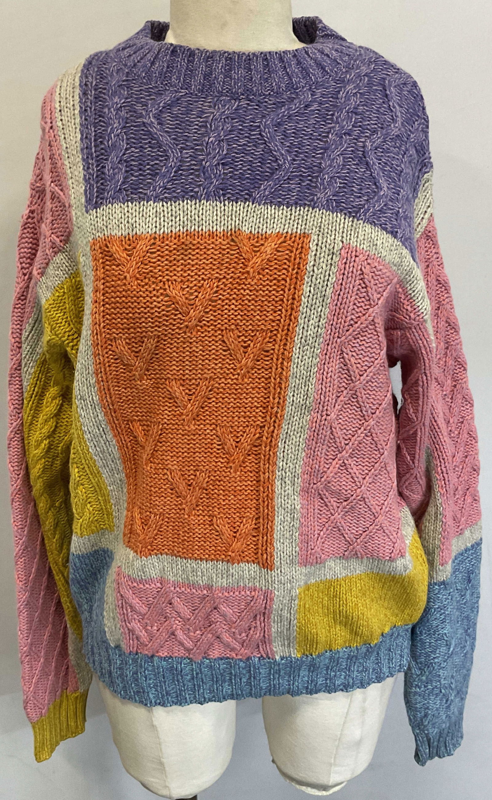 Gianni Versace Multicolor Sweater Italy: Gianni Versace multicolor sweater. Made in Italy. Size 48. Wool material. Striped design with purple, pink, orange, yellow, blue, and grey. Geometric pattern stitching. Ribbed trim. Some wear consiste