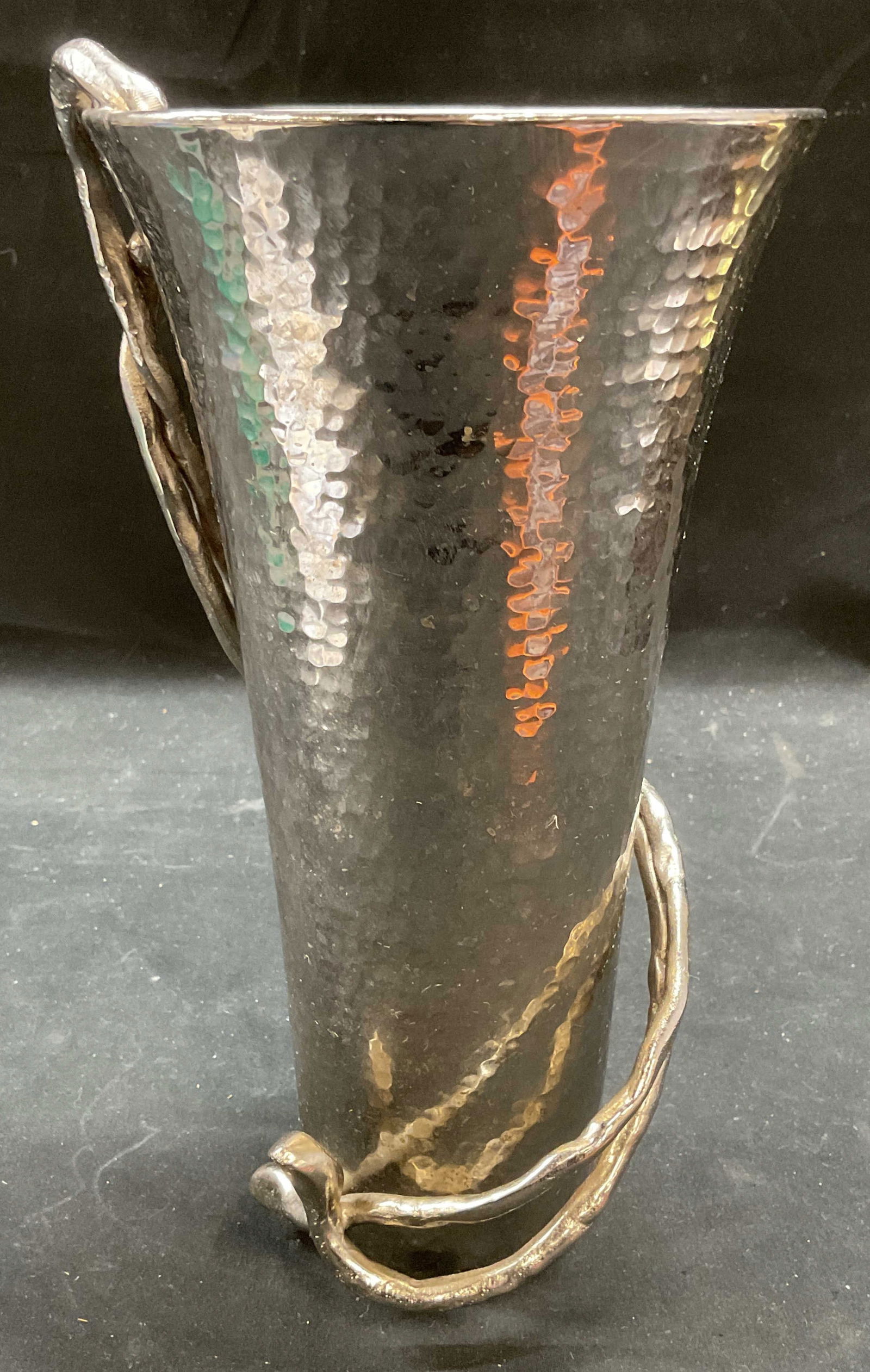 Michael Aram Wisteria Silver Tone Vase: Signed Michael Aram silver tone Wisteria vase. Hammered metal with applied vine motif decoration. Measures approx 5.25 x 10 inches. Some scratching. Michael Aram vase, wisteria vase, silver tone vase,