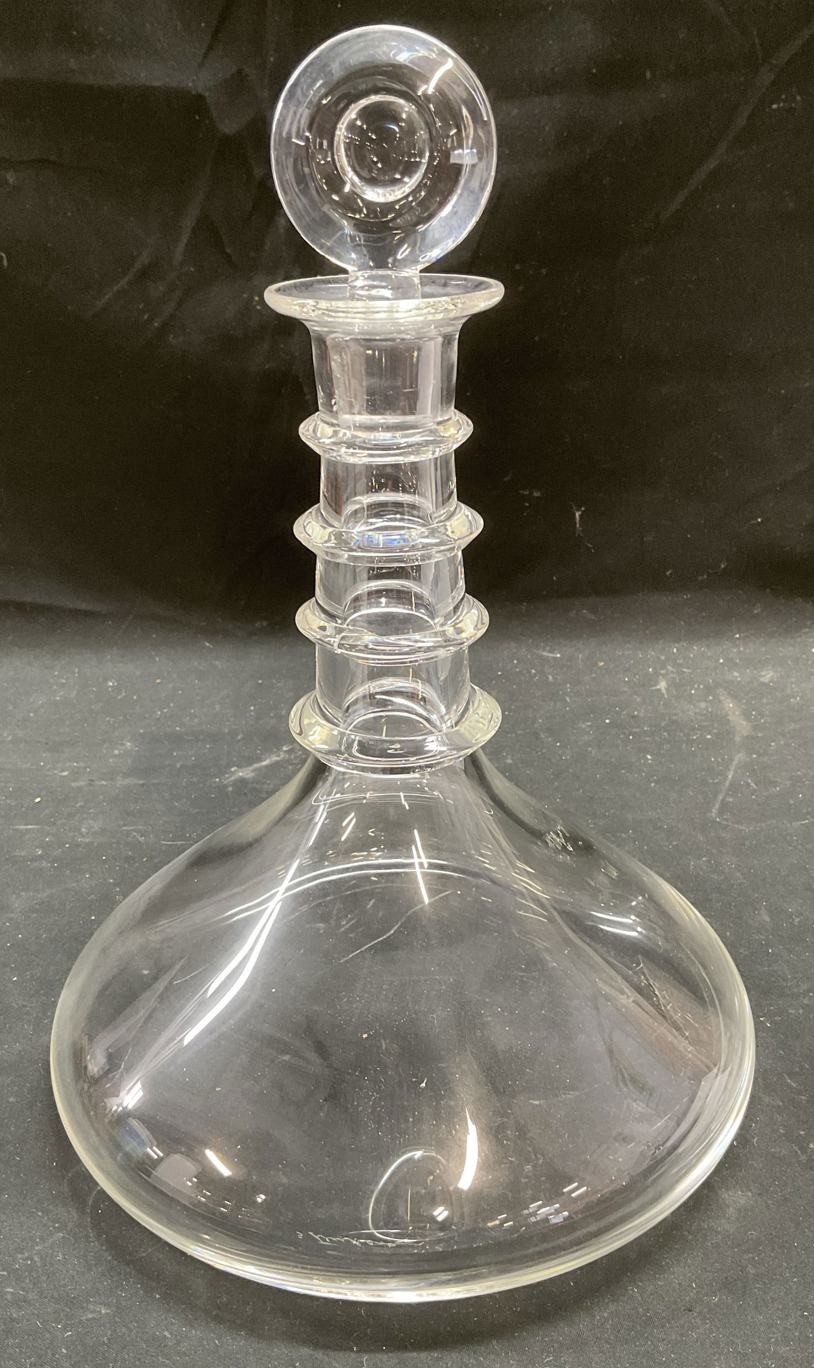Steuben Art Glass Ships Decanter: Steuben hand blown art glass ships decanter. Round stopper. Applied rings on neck. Signed. Measures approx 7 x 8 inches. Decanter has weight. Some scratching. Steuben decanter, ships decanter, art gla