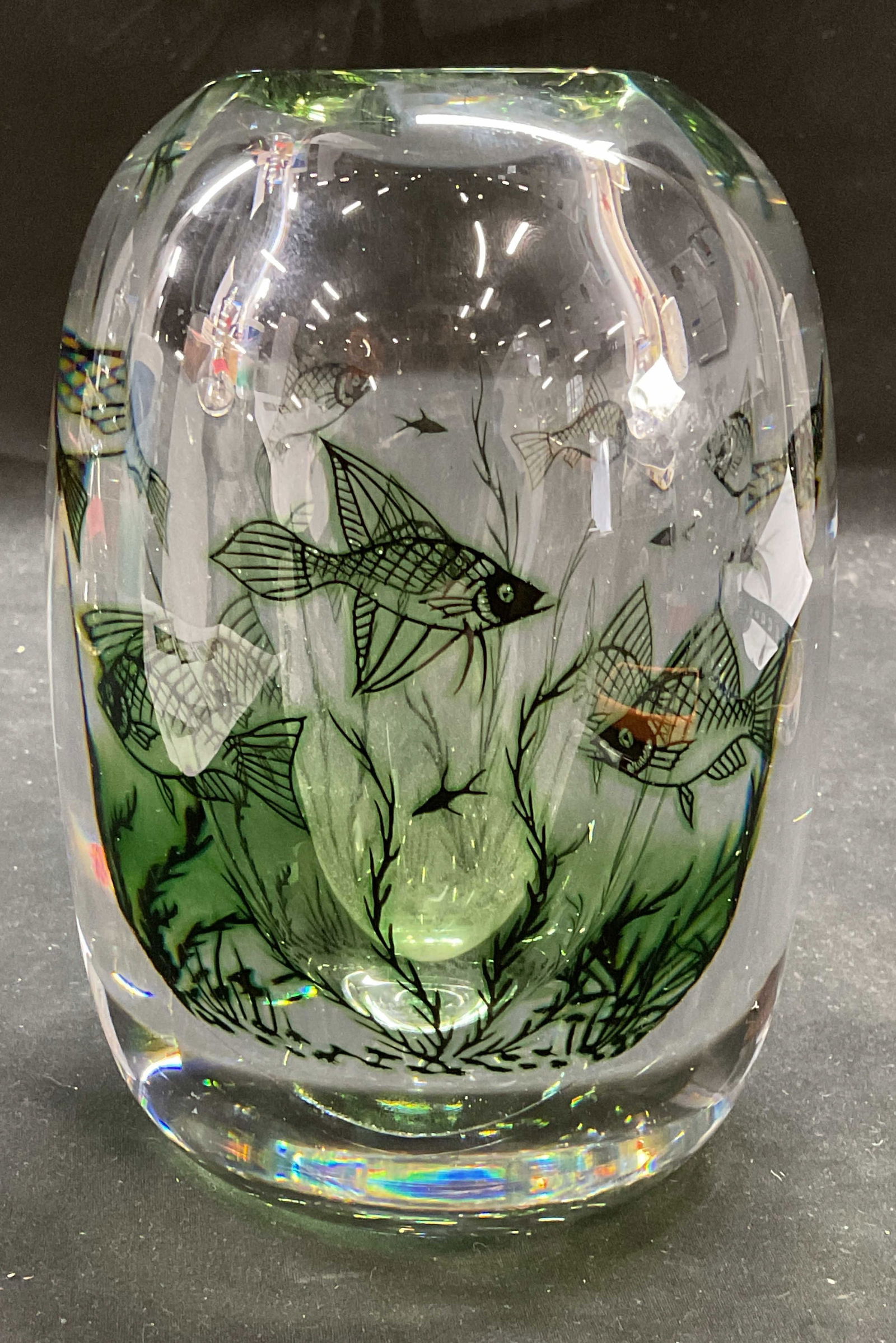 ORREFORS Hald Fish Graal Art Glass Vase: ORREFORS hand blown art glass vase. Designed by Edward Hald. Fish Graal. Cased glass with fish sea motif in green. Signed on underside. Measures approx 4.5 x 6.5 inches. Vase is heavy. Some scratches.