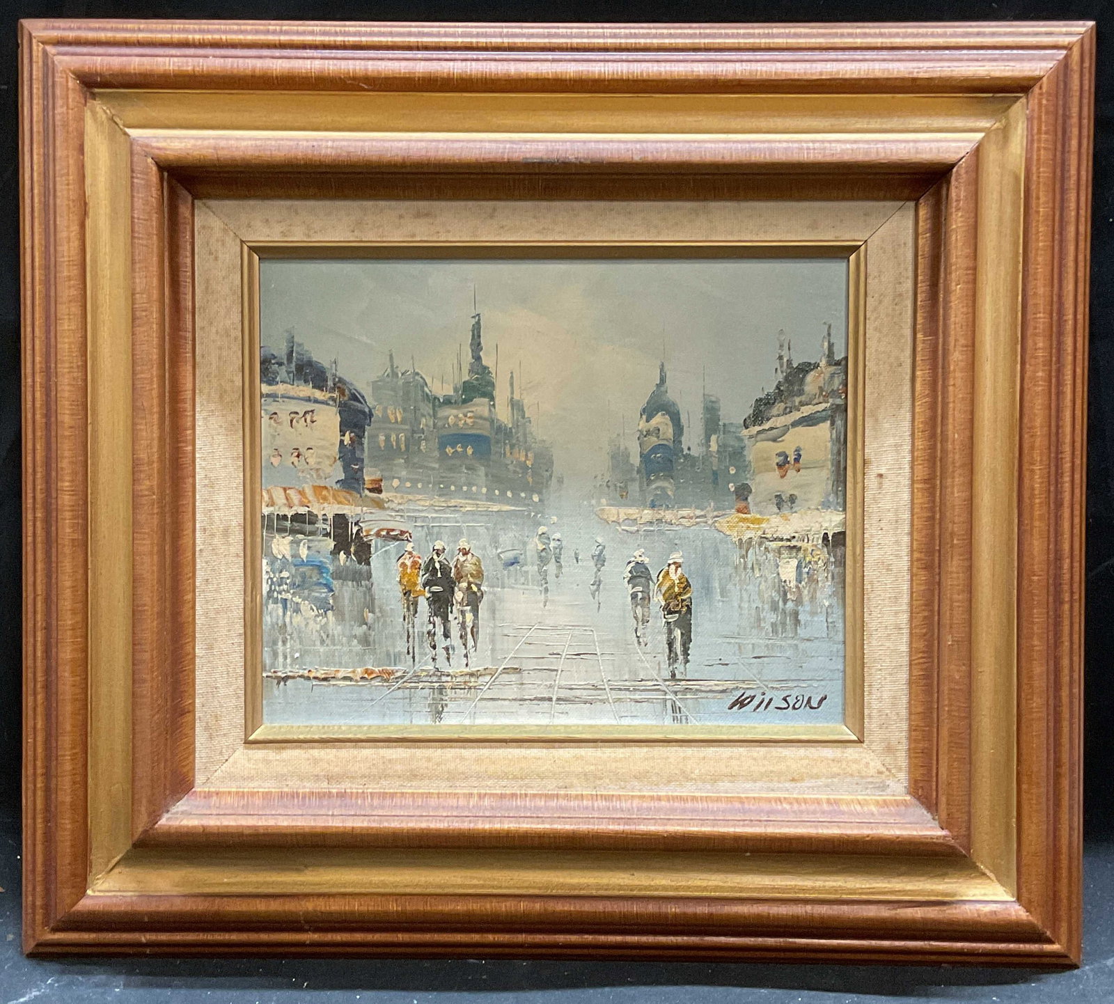 Signed Wilson Paris Street Scene Oil Painting: Framed oil on board painting. Signed lower right, Wilson. Paris street scene, figures walking with architecture. Wood frame with gilt border. Not examined out of frame. Frame measures approx 15 x 17 i
