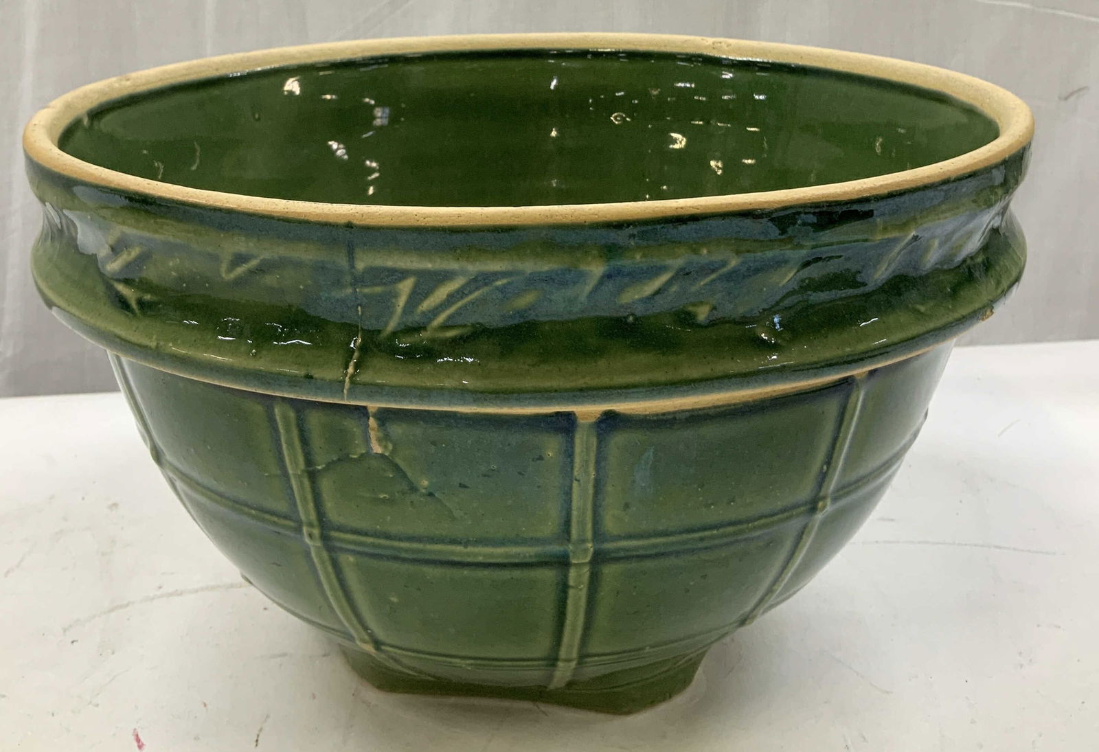 McCoy Green Windowpane Ceramic Mixing Bowl: Green mixing bowl features a distinctive raised windowpane design on body & collared rim. Glossy finish. Bowl is ceramic & appears to be possible McCoy. No visible signature or markings. Surface wear