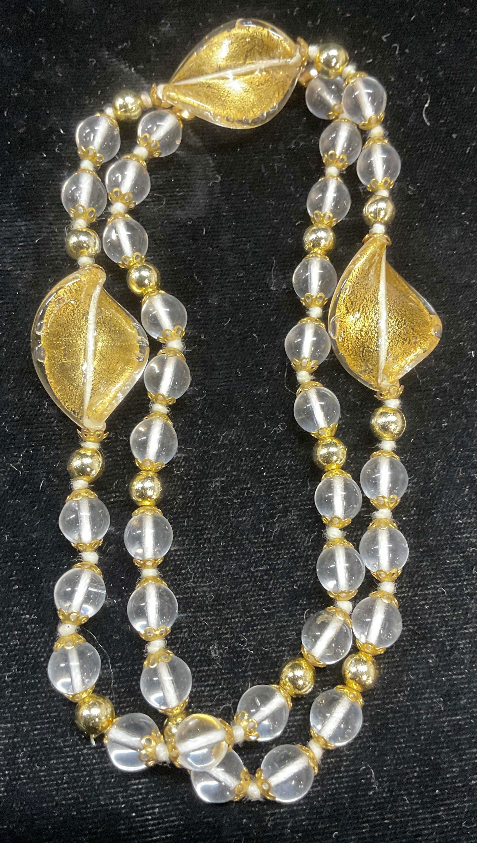 Vintage Gold Fleck Art Glass Beaded Necklace: Vintage art glass beaded necklace. Clear and gold fleck art glass beads with gold tone accents. Drop length approx 10.5 inches. Some scratching. Jewelry, estate jewelry, costume jewelry, cocktail jewe