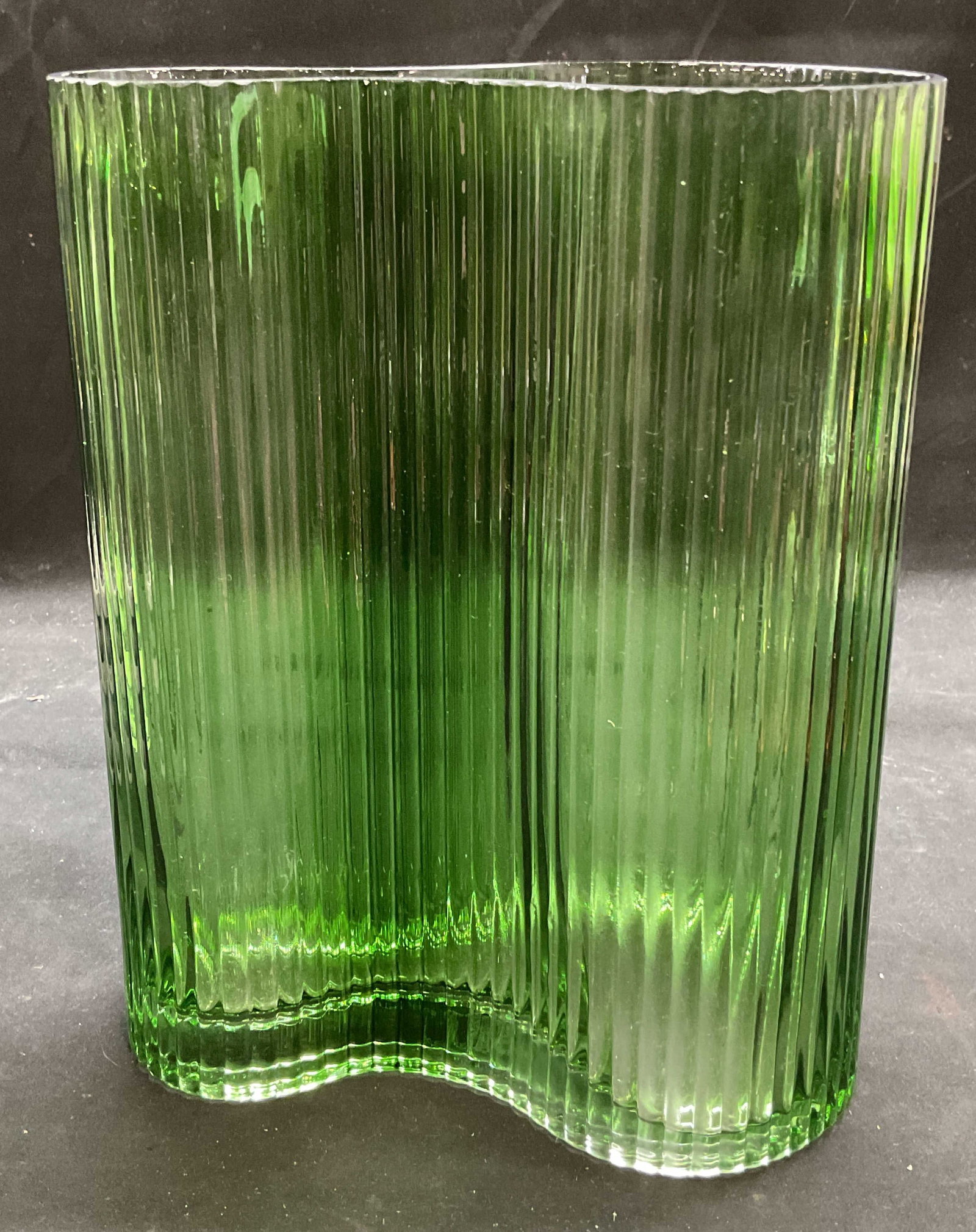 Tozai Green Glass Ribbed Organic Modernist Vase: Signed Tozai green ribbed glass vase. Organic undulating shape. Measures approx 7 x 4.75 x 9.5 inches. Some wear consistent with exposure. Green vase, glass vase, ribbed vase, organic vase, home decor