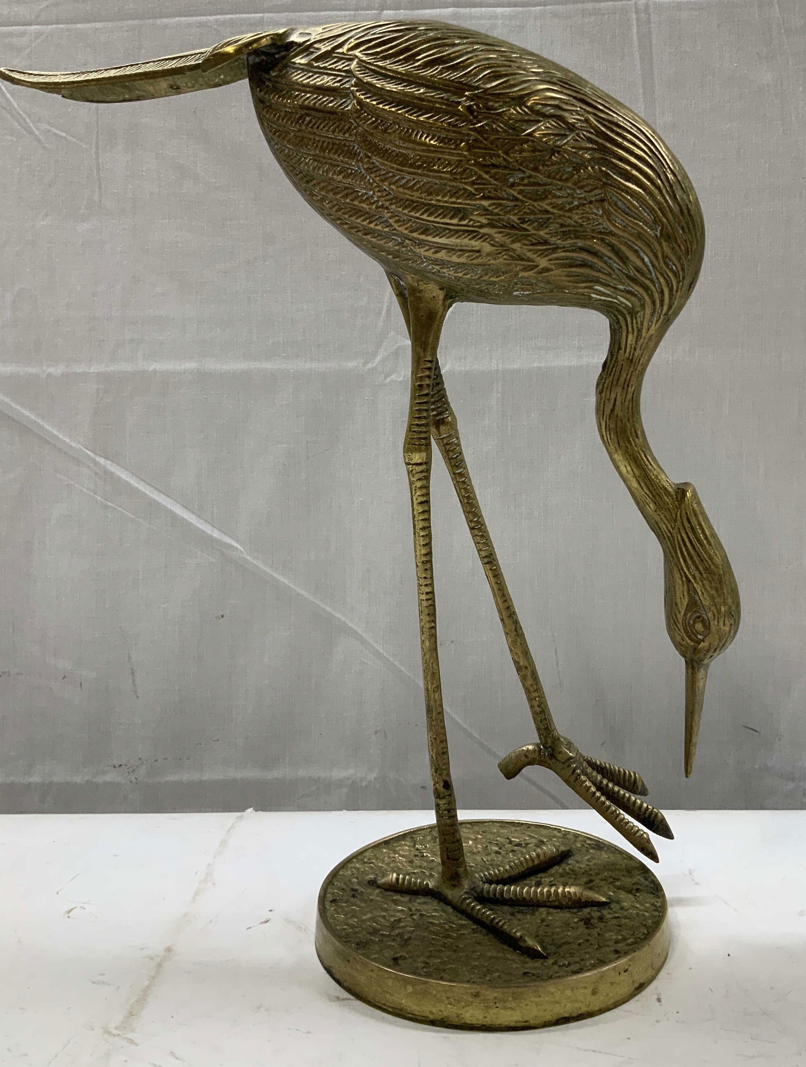 Vntg Brass Pecking Heron Sculpture 14in: Sculpture is brass & depicts a heron bird with its long neck curved down and its beak pointing towards circular base. Appears to be pecking. Textured details on feathers & legs. No visible signature o