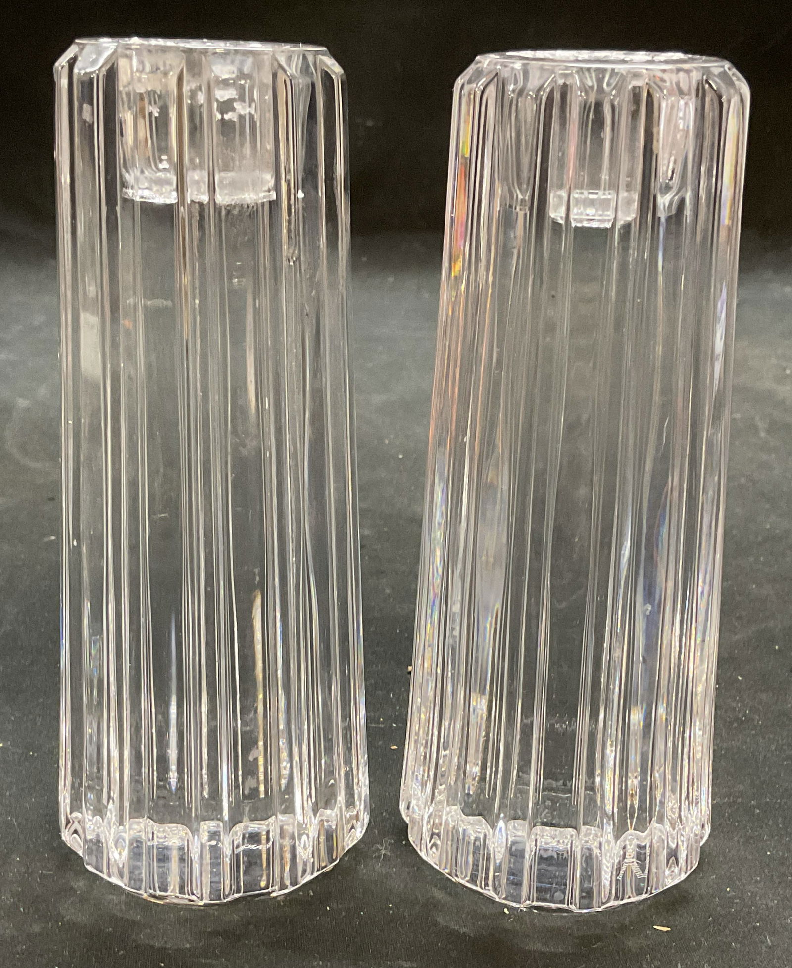 Pair Tiffany & Co Atlas Crystal Candlesticks: Pair of Tiffany & Co Atlas candlesticks. Vertical tapered pillars with ribbed designs. Signed. Measure approx 2.25 x 5.25 inches. Candlesticks have weight. Some scratching. Tiffany and co atlas, Tiffa
