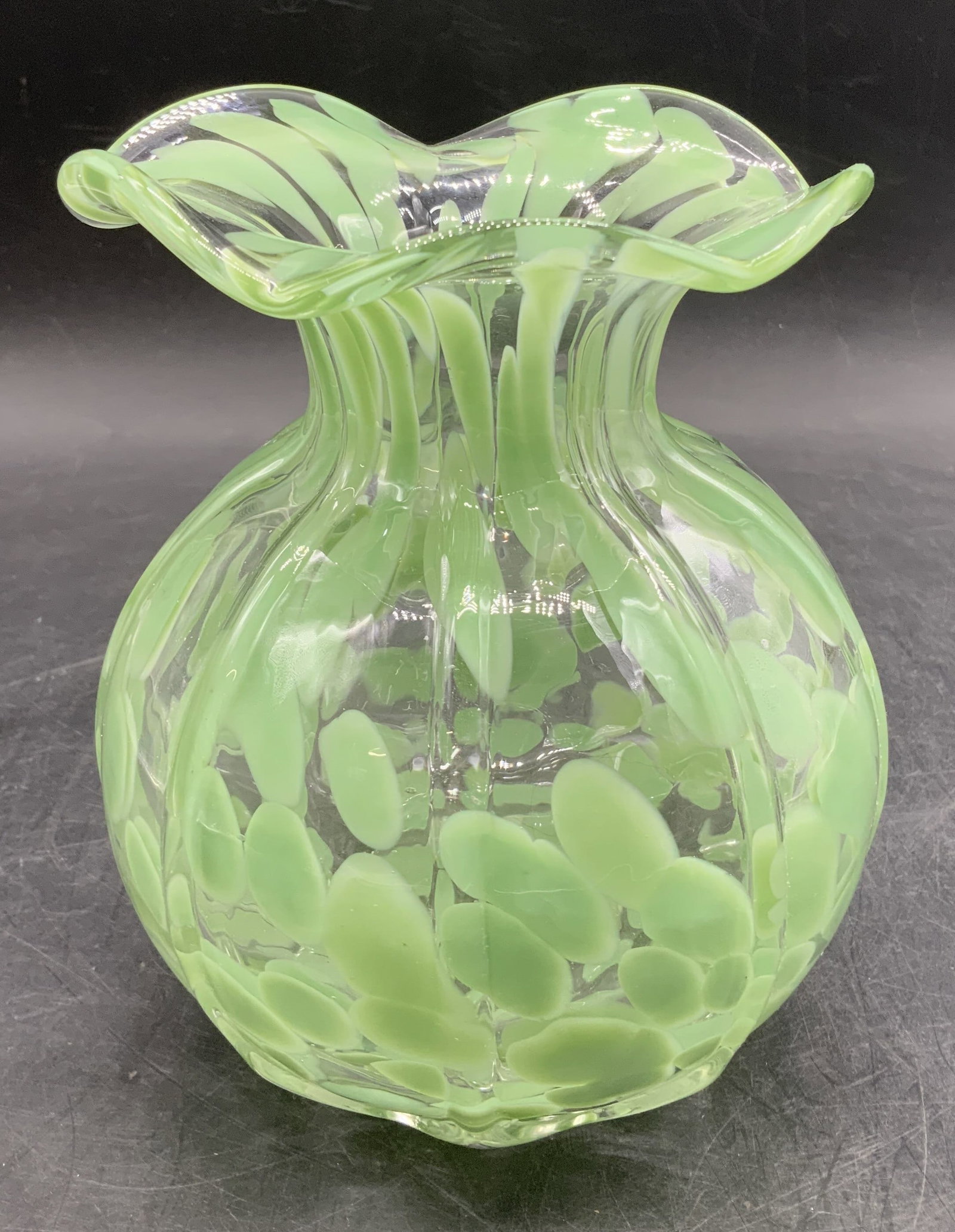 Hand Blown Green Spotted Art Glass Vase: Vase features a bulbous ribbed body, short neck, & ruffled edge. Light green spotted pattern. Hand blown art glass vase. Surface wear consistent to age, use & exposure. No visible signature or marking