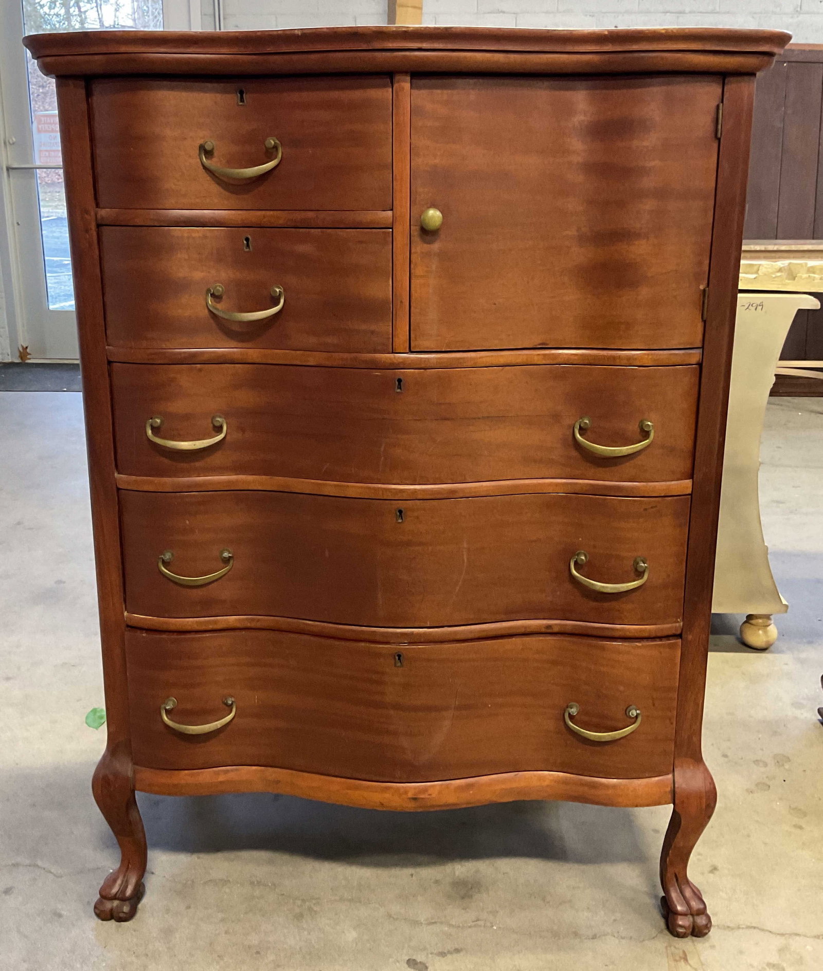 Vintage Wood Clawfoot 5 Drawer Dresser: Vintage wood dresser. Curved design with claw feet. 5 drawers and 1 door. Measures approx 36 x 20.5 x 38 inches. Some scratching and small chips. Dresser, vintage dresser, wood dresser, clawfoot dress