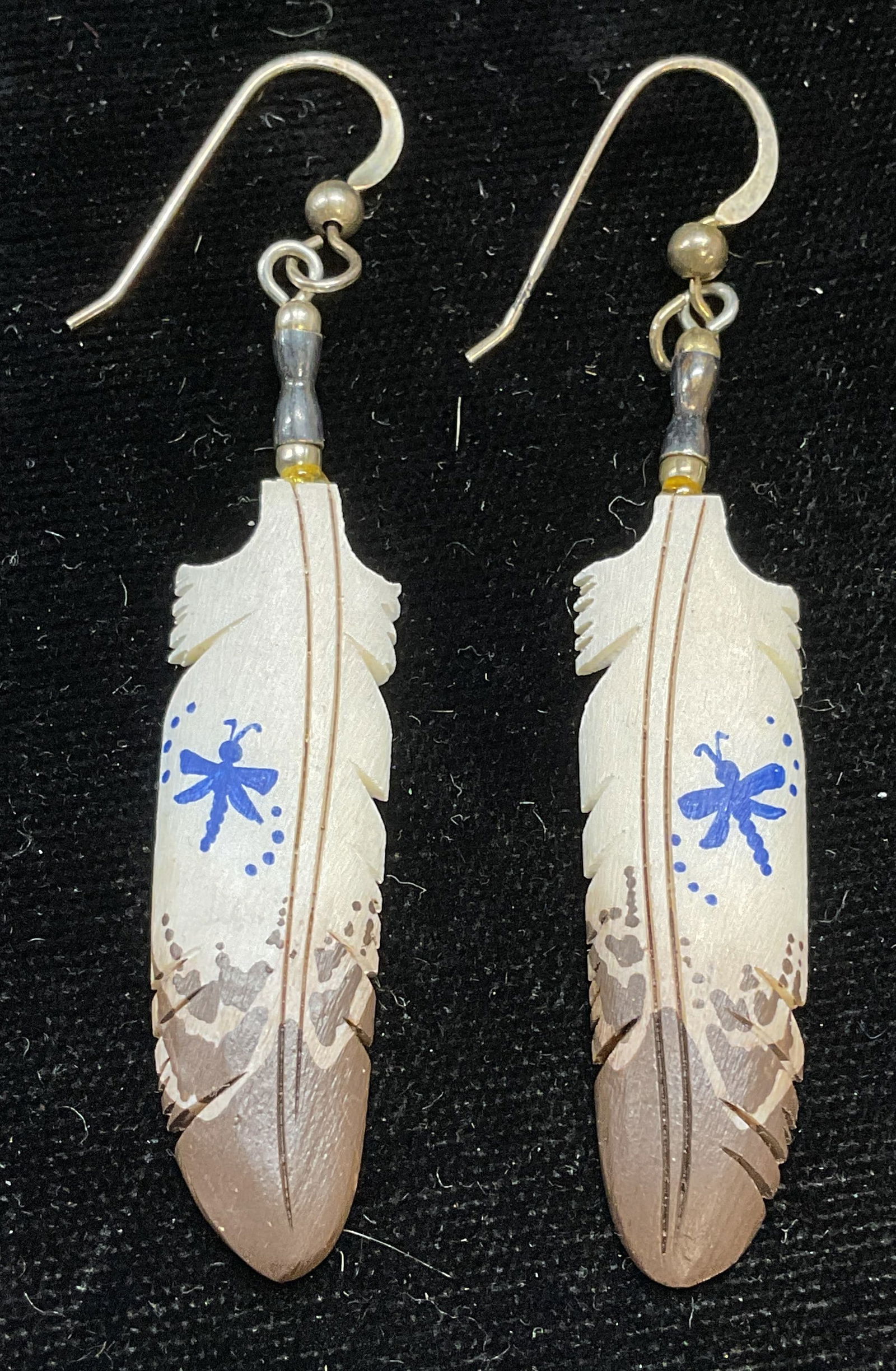 Lonny Cloud Hand Painted Bone Sterling Earrings: Signed Lonny Cloud Native American artisan earrings. Hand carved and painted feather motif bone with dragonfly design. Sterling silver ball and hooks. Measure approx 2 inches long. Some scratching. Je