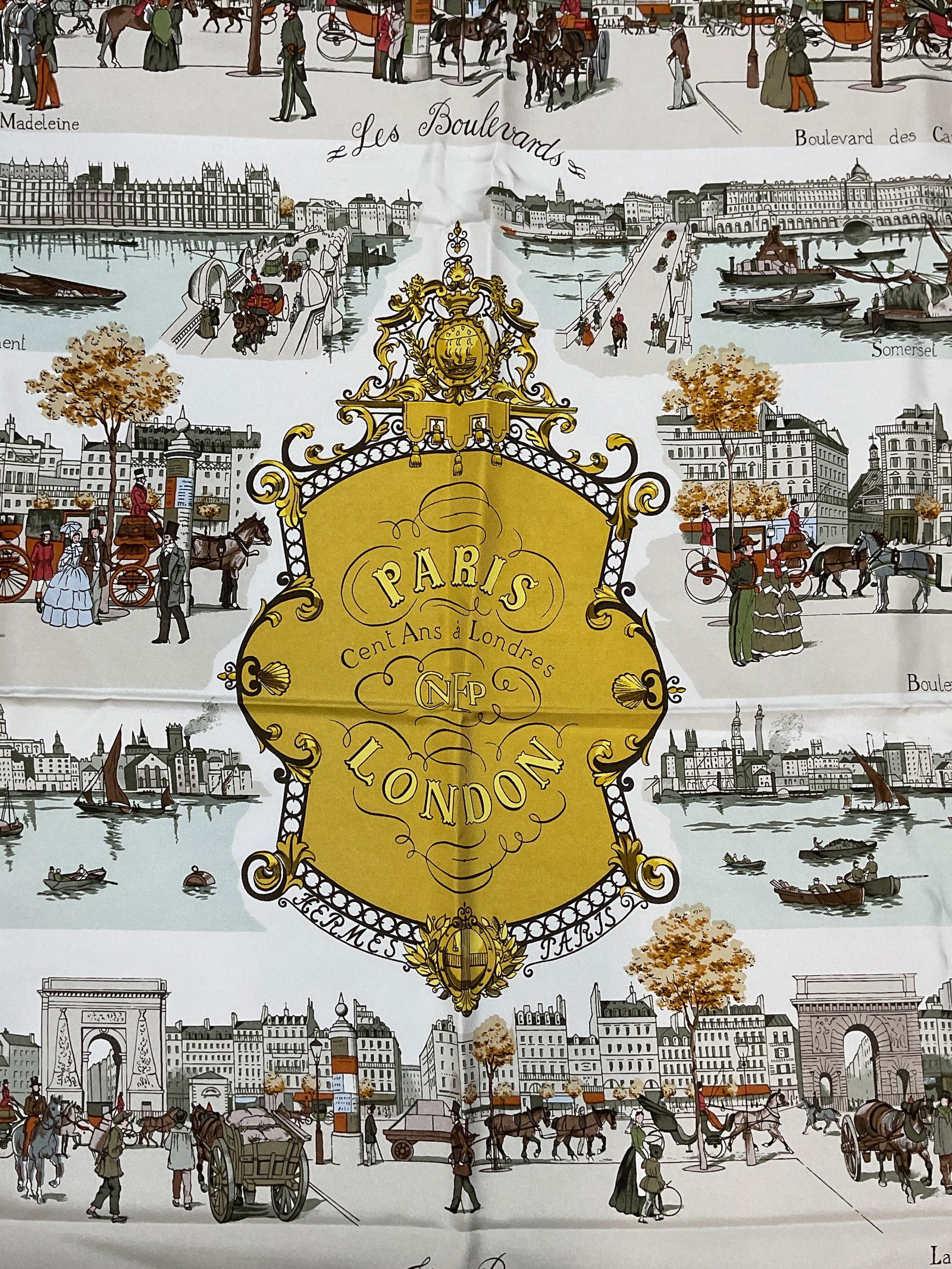 Vtg Hermes Paris London 1850 Silk Scarf, France: Vintage Hermes silk scarf. Paris London 1850 by Philippe Ledoux. Urban scenery with figures and landmarks. Hand rolled edges. Measures approx 34 x 34 inches. Made in France. Some wear consistent with