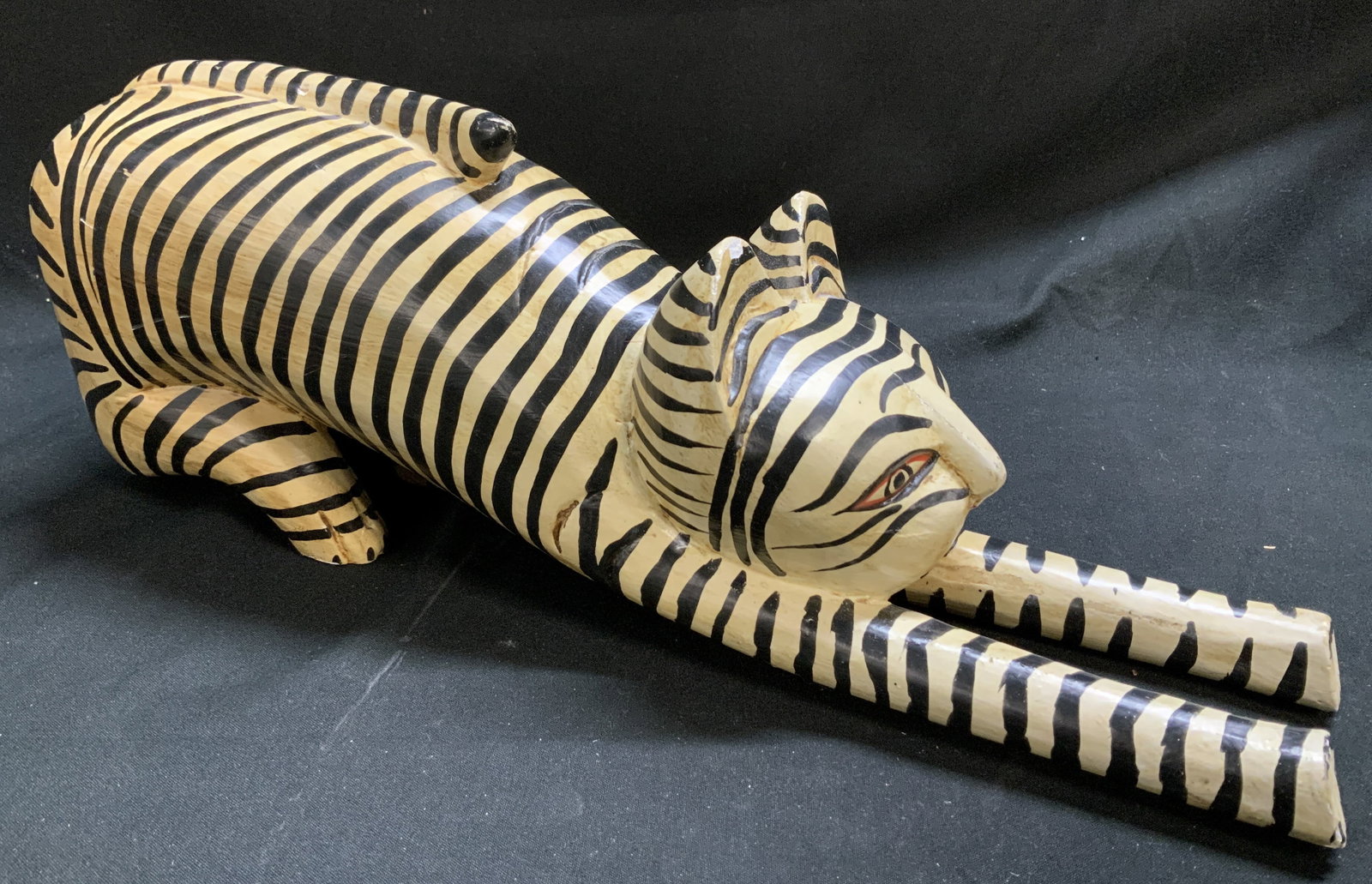 Vtg Hand Carved Wooden Cat Figurine INDONESIA: Long, stretched out wooden cat figurine featuring black striping. Hand-painted facial features. Folk art style. Signed & marked. Reads, MADE IN INDONESIA. Surface wear consistent to age, use & exposur