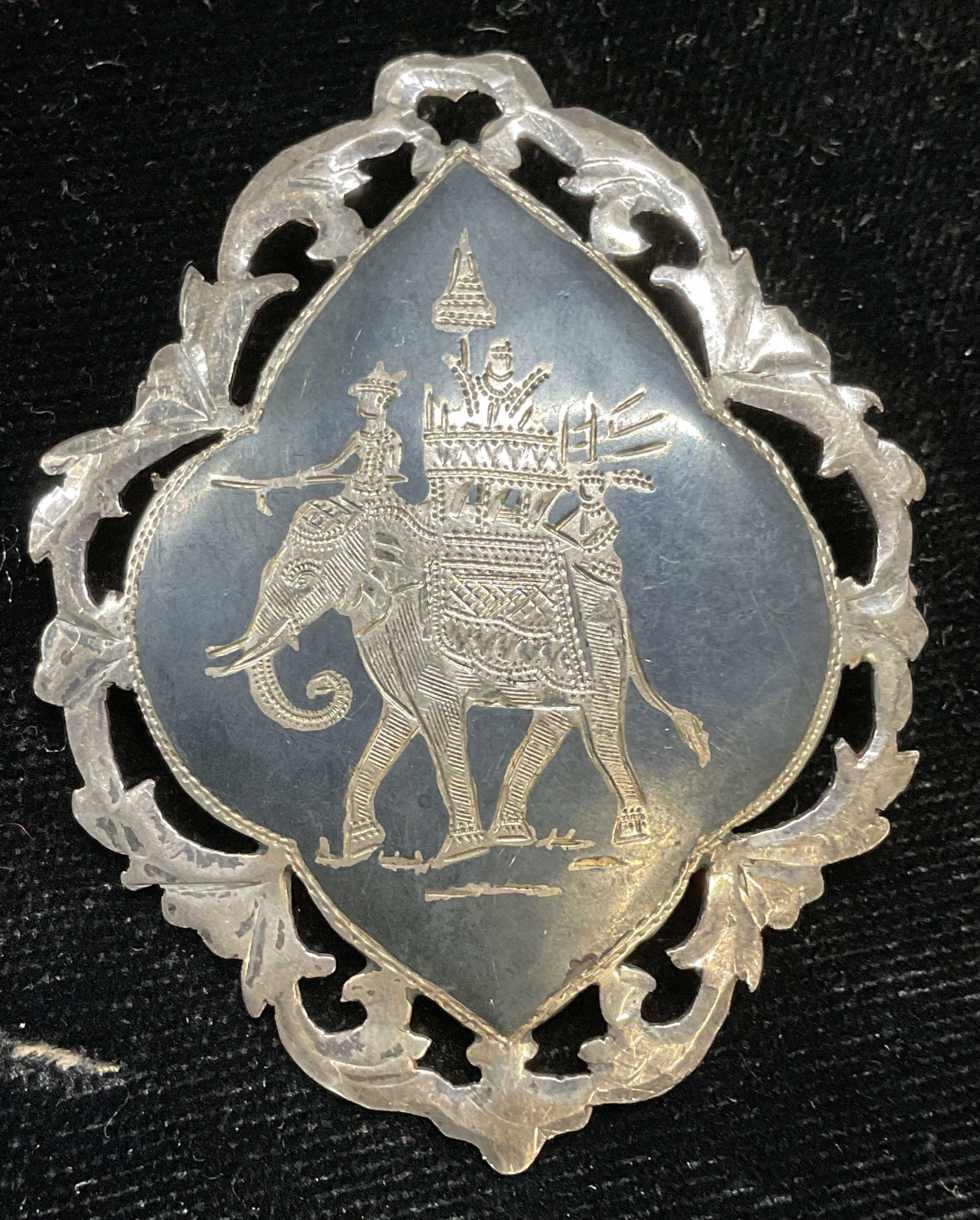 Vintage Sterling Silver Elephant Brooch, Siam: Vintage sterling silver reticulated brooch with etched processional elephant motif. Made in Siam. Marked sterling. Measures approx 2 x 1.5 inches. Total weight 9.7 grams. Some scratching. Jewelry, est