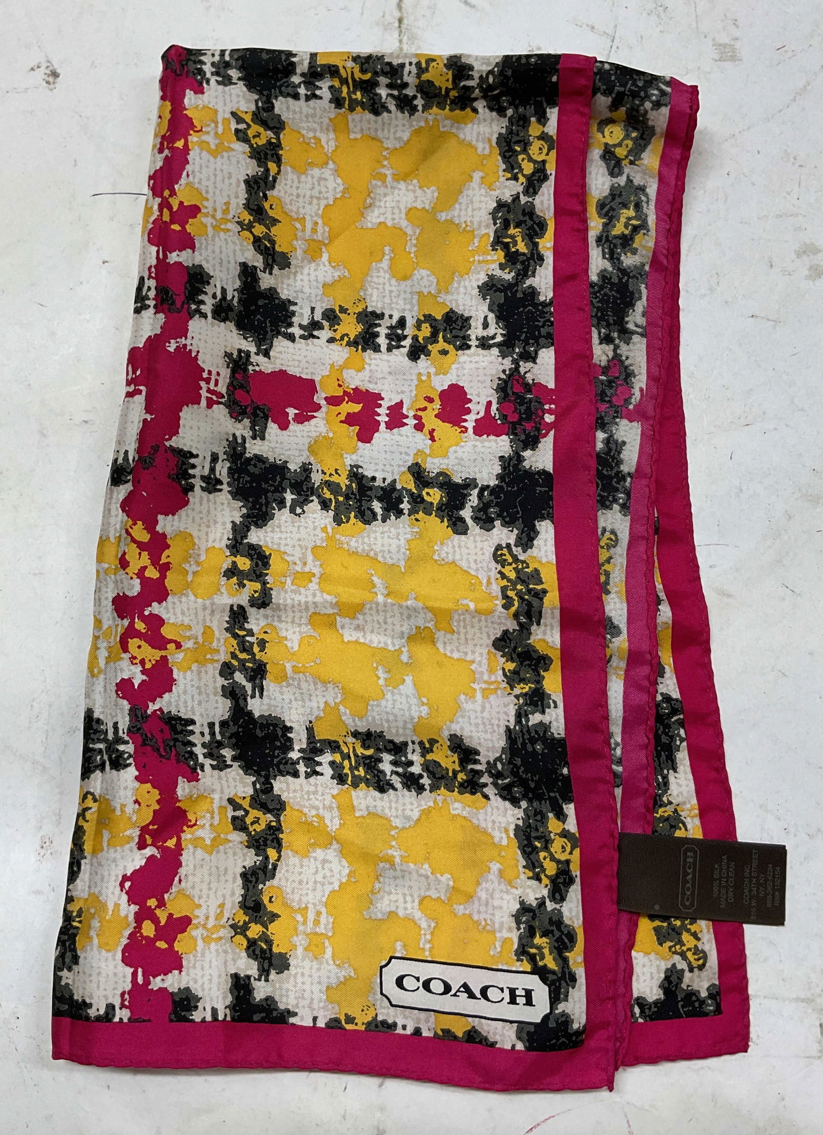 Vintage Coach Abstract Pattern Silk Scarf: Vintage Coach abstract patterned silk scarf. Silk material. Pink border. Abstract patterned in white, pink, yellow, and black. Measures approx 16 x 26 inches. Wear consistent with exposure. Scarf, sil