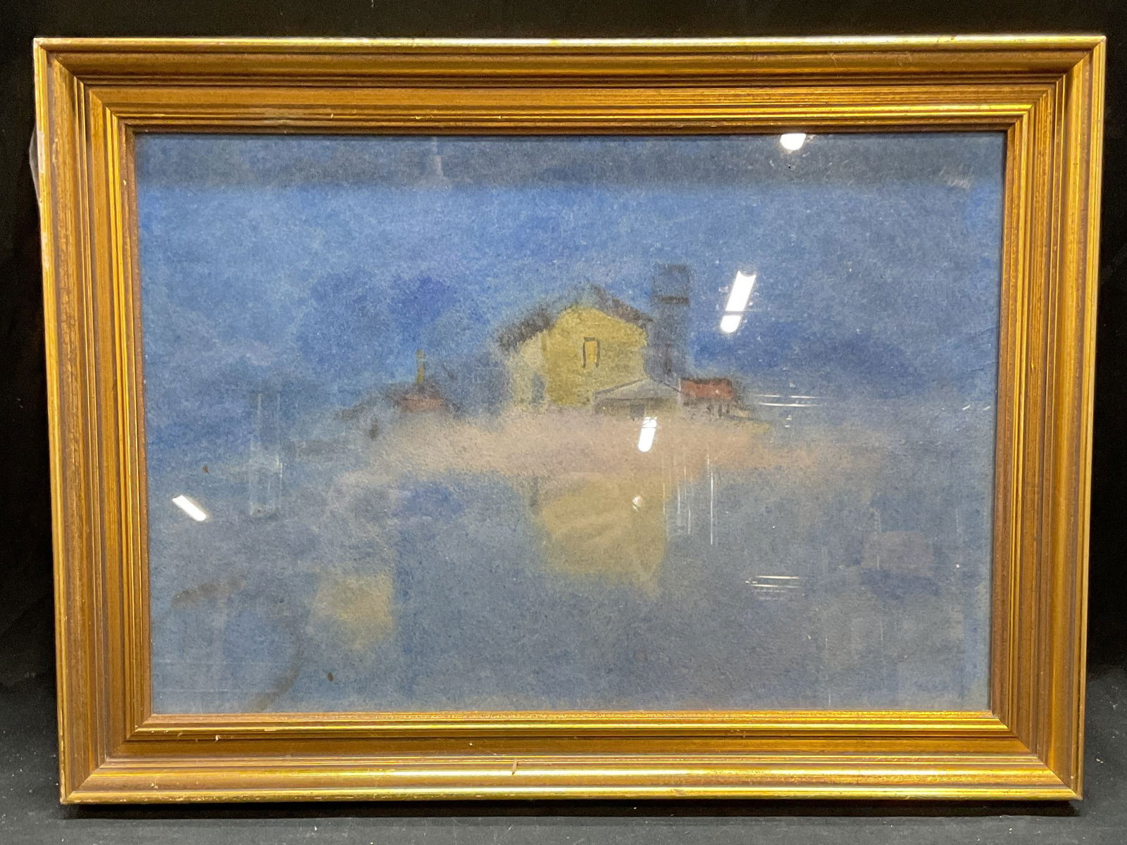 Framed House Work on Paper: Framed work on paper. Abstracted view of a house in blue and yellow. Possibly pastel. Gilt wood frame. Not examined out of frame. Frame measures approx 14 x 19 inches. Some wear consistent with exposu