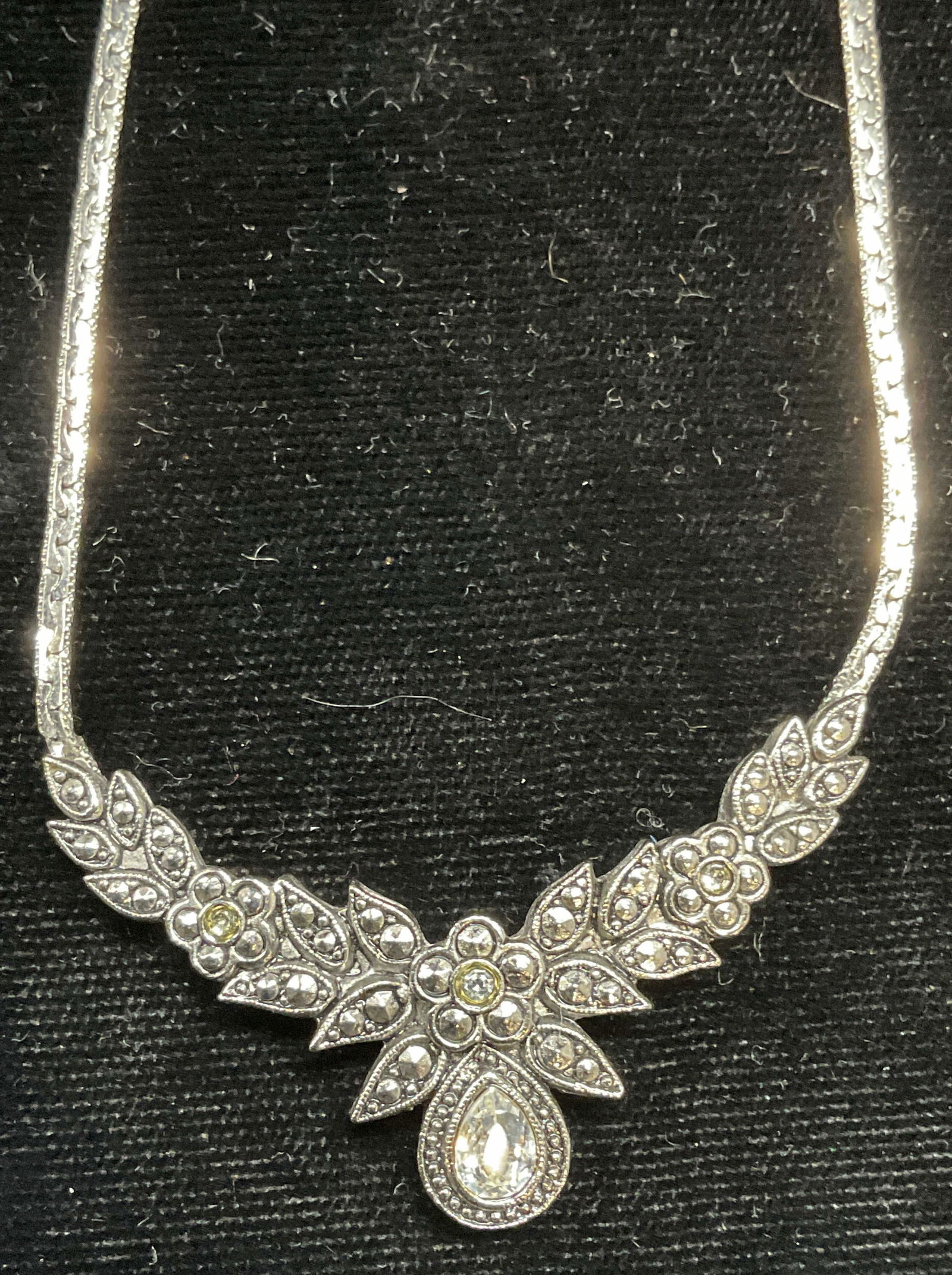 Silver Tone Crystal Floral Pendant Necklace: Silver tone floral pendant necklace with colorless crystals. Drop length approx 8 inches. Some scratching. Jewelry, estate jewelry, costume jewelry, cocktail jewelry, fashion jewelry, accessories, fas